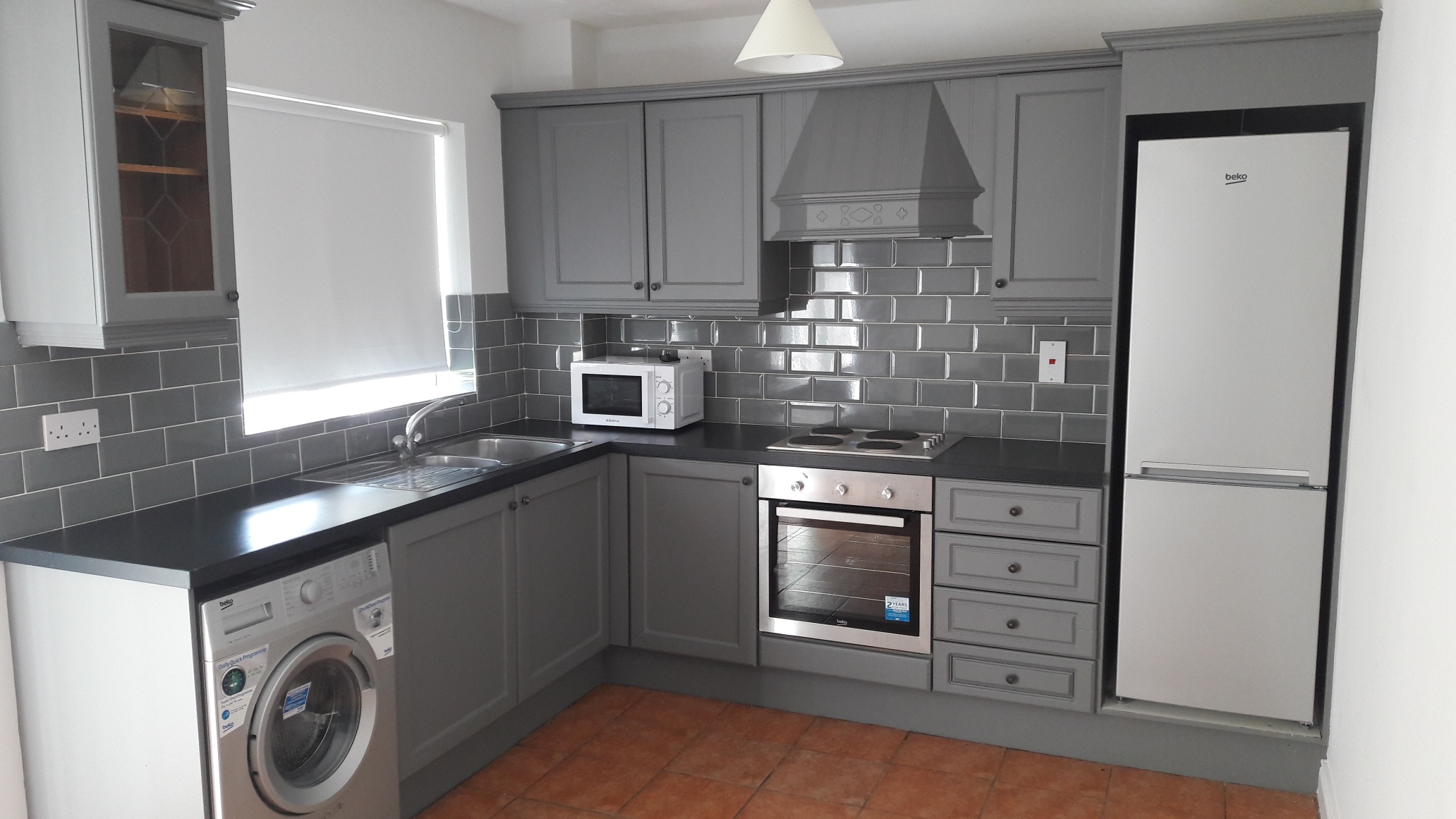 Grey kitchen with grey subway tiles.jpg