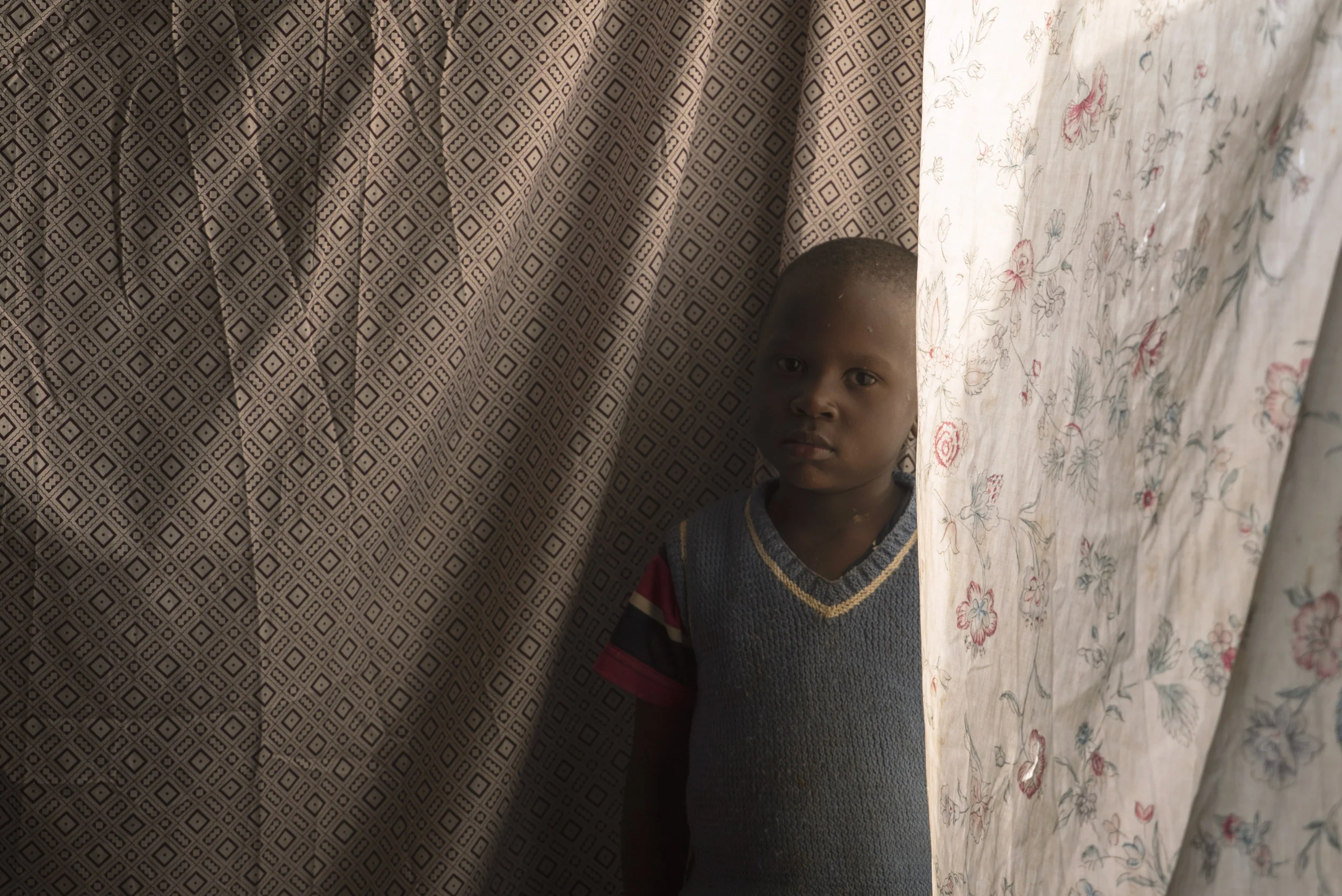 Ronnie, Johnstone Mukabi's grandson, at home near Eldoret