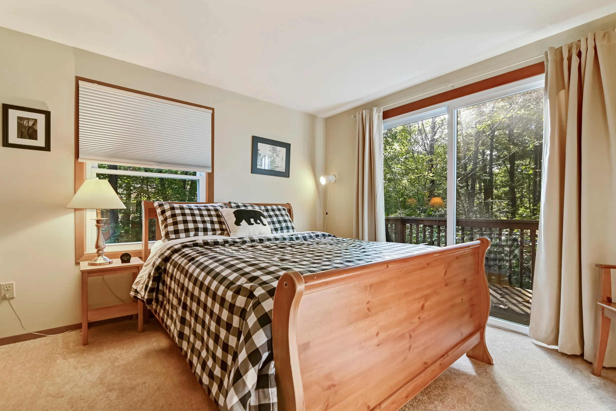 Main bedroom with queen bed and balcony.jpg