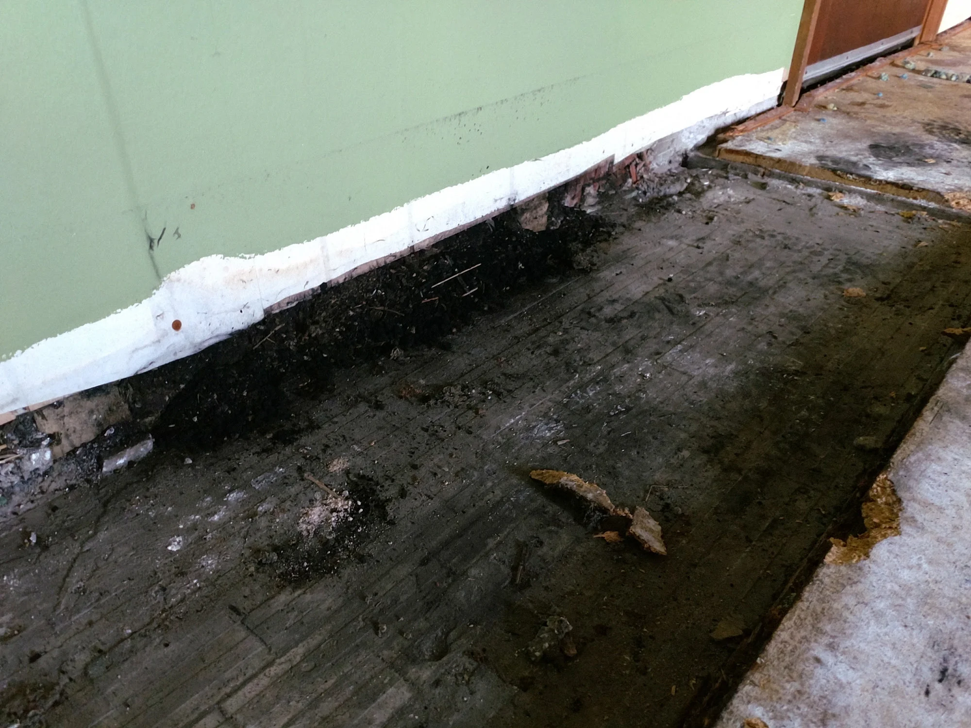 If you ever decide you don't want your fireplace anymore, you definitely should not clear out the soot before covering it. Nope. No fire hazards here.