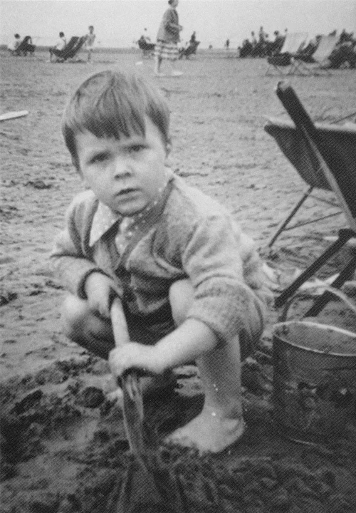 Young Charlie on the beach with his bucket and spade!