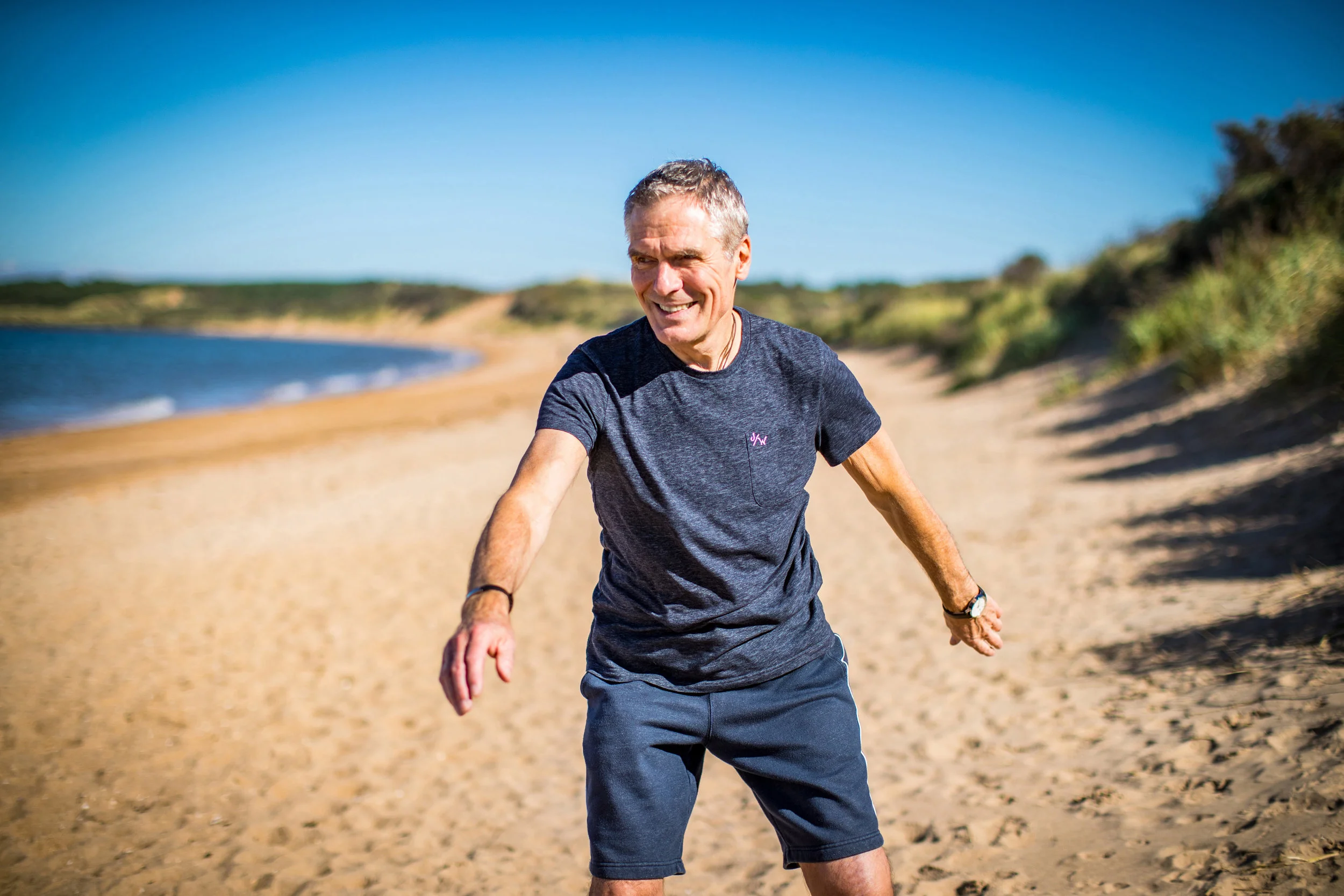 Charlie Jackson practising Chi Gung on a beautiful sandy beach