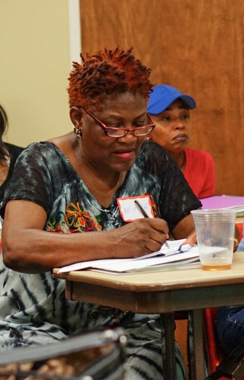   Week 3:   Mariama takes copious notes as our community partner, Alliance Medical Ministry, discusses strategies for ensuring good health, and outlines resources available in the Raleigh/Wake County area to assist with medical needs.  