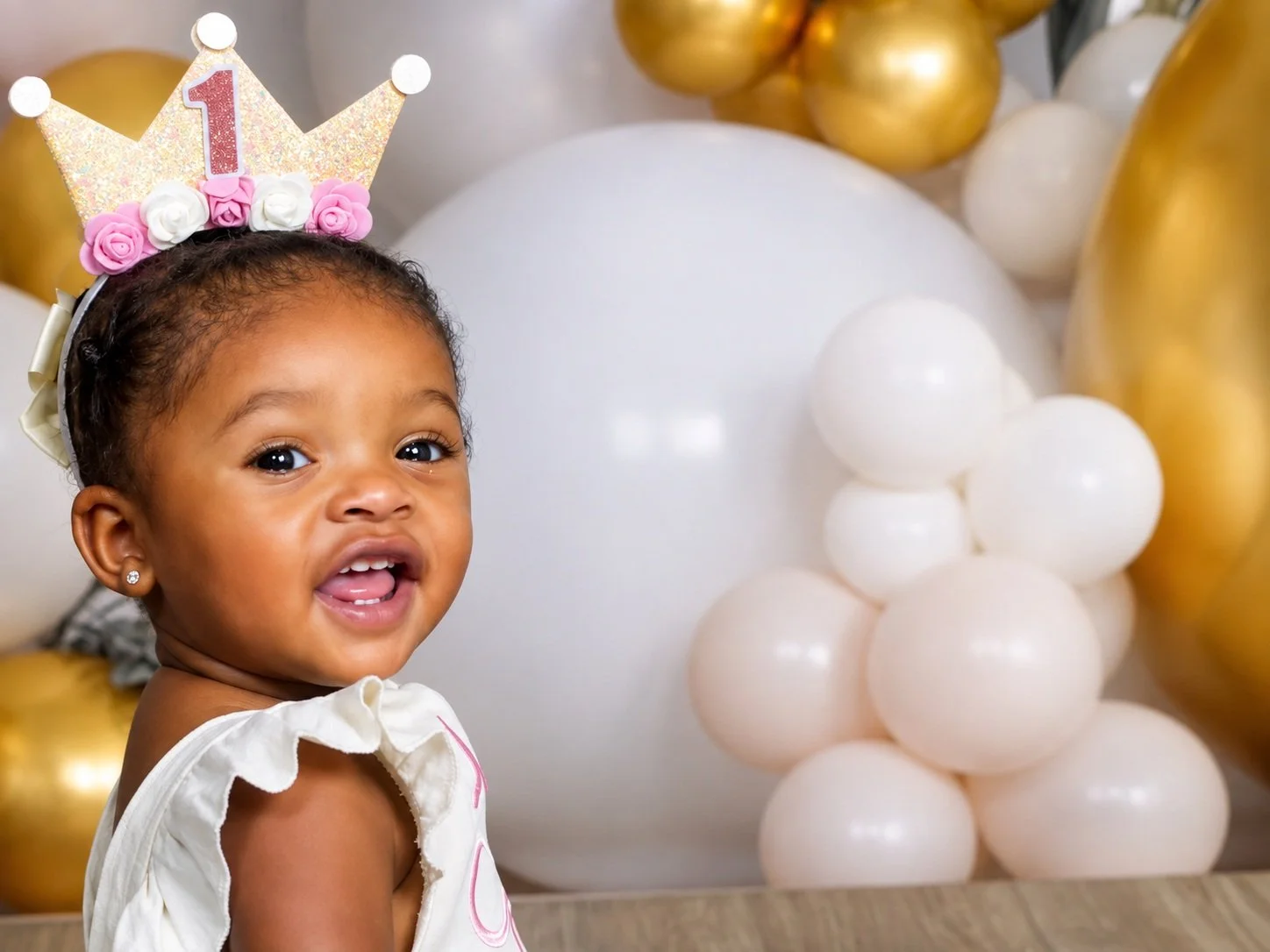 Ashley Lewis' daughter on her first birthday photoshoot.