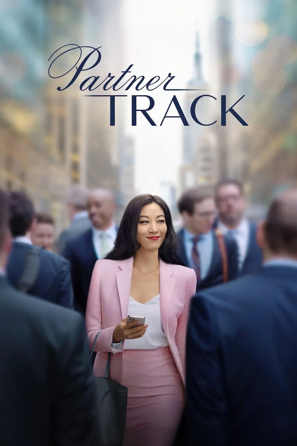 A woman in a pink suit standing among a group of businessmen on a city street, holding a smartphone, with the title "Partner Track" above her.