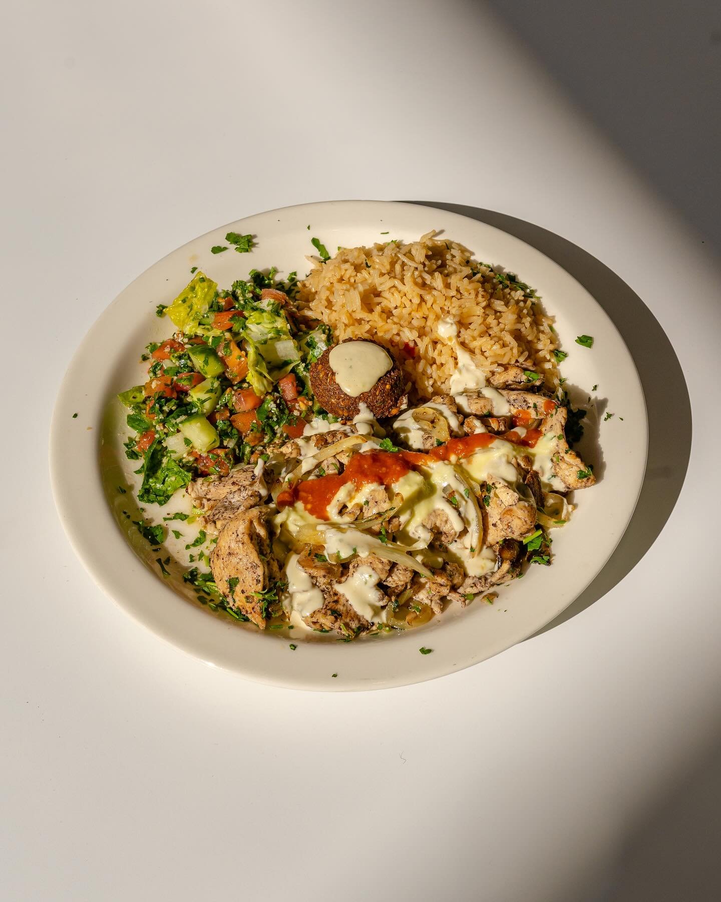 What&rsquo;s on the plate? ☟

~ Tabouli, rice, chicken shawarma, and hot crispy falafel to top it off! ~