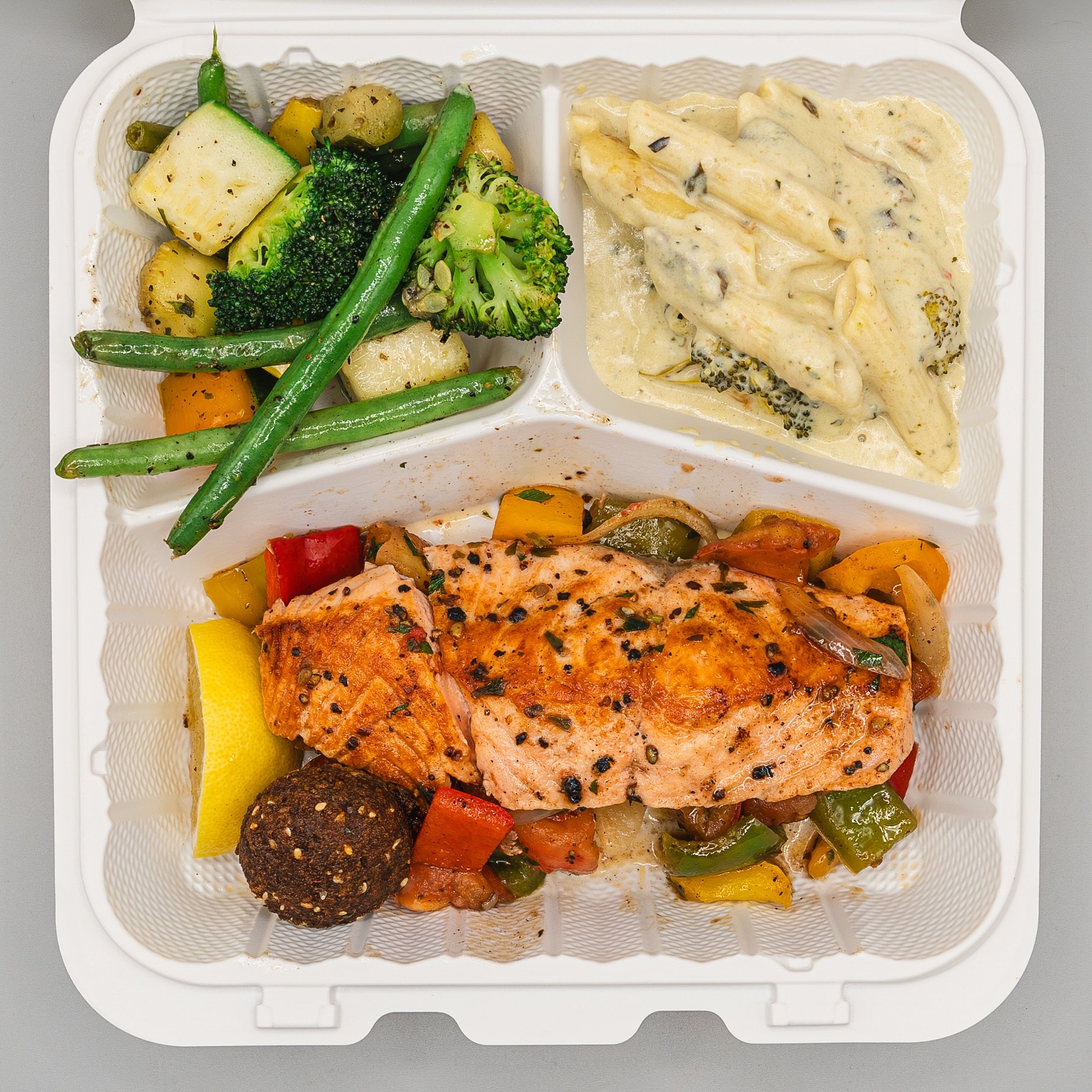 Order inspo of the day! ➡︎ Grilled veggies, pasta alfredo, salmon, and a crispy falafel to top it off!