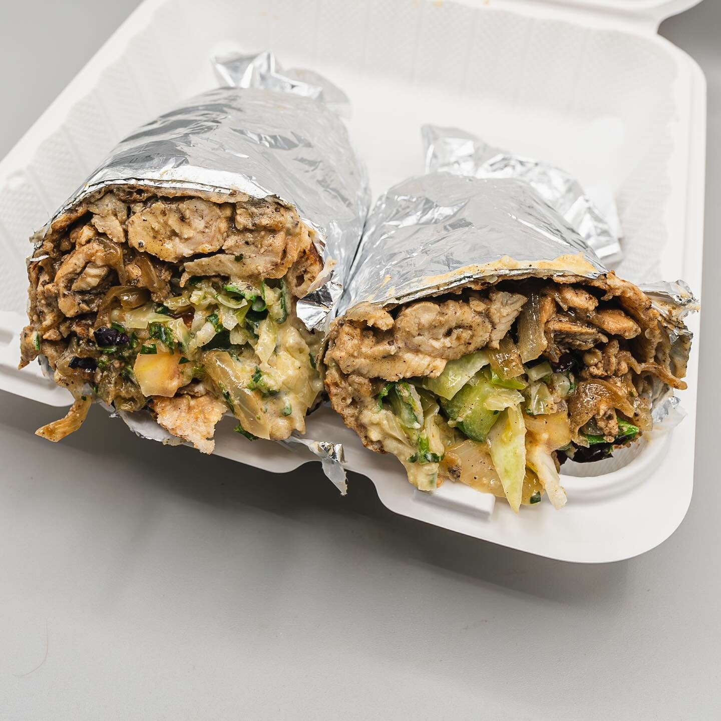 Chicken Shawarma Wrap ~ Our best seller! Halal, hormone-free chicken breast, thinly sliced, grilled with white onions and Turkish spices. Have it as a wrap as a delicious &ldquo;on-the-go&rdquo; meal!