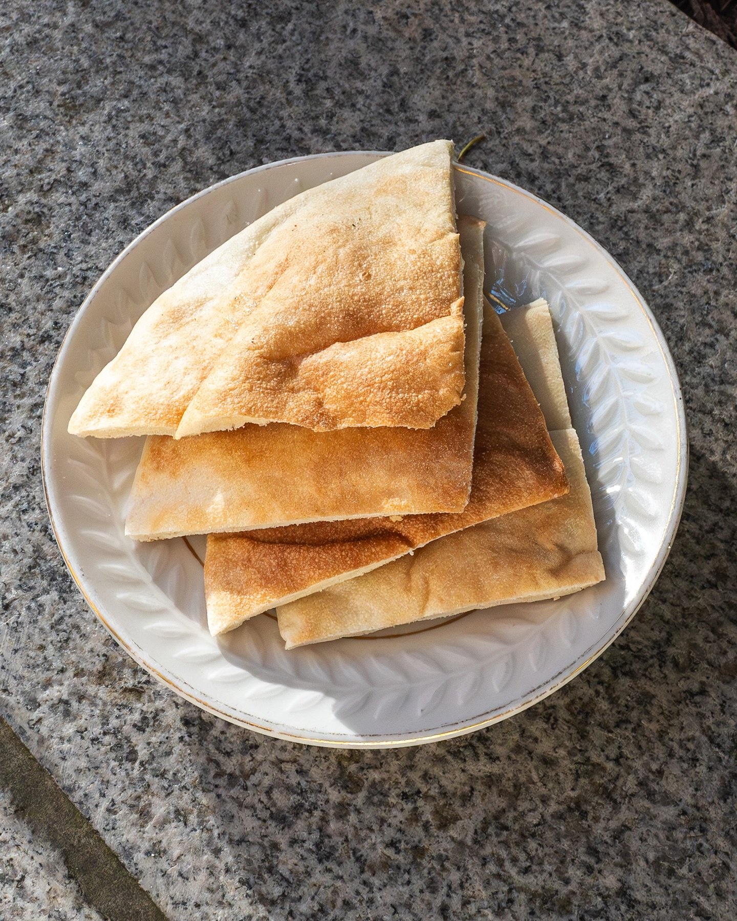 Our house-made pita. 💚 Crafted daily with care, each pita wraps the essence of Mediterranean hospitality in its soft, fluffy embrace, promising homemade goodness in every bite.