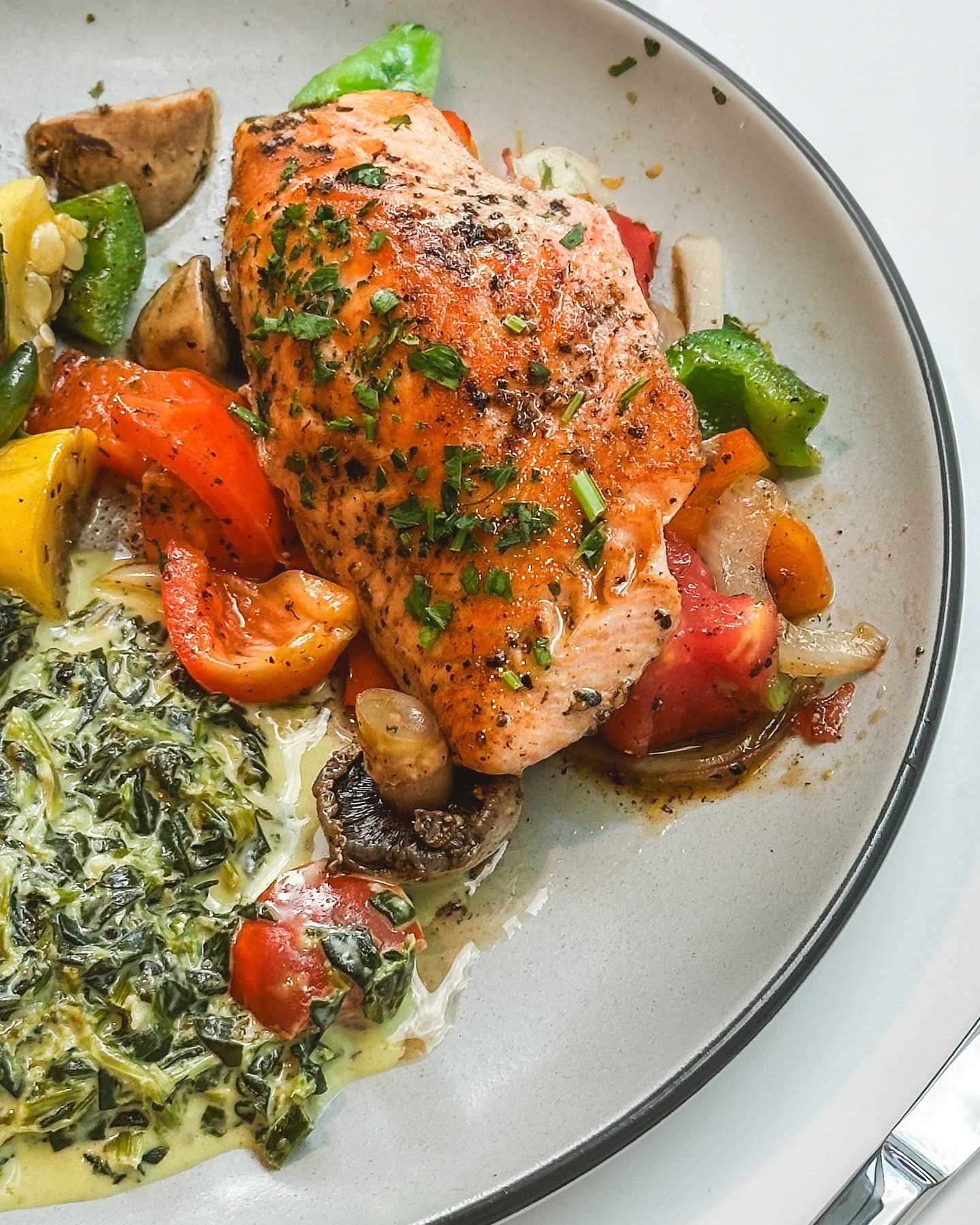 Fresh, simple, and made with love. Our Scottish Salmon is filleted in-house daily, lightly seasoned with extra virgin olive oil, kosher salt, and black pepper, then perfectly grilled alongside peppers, tomatoes, and onions. Finished with a squeeze of