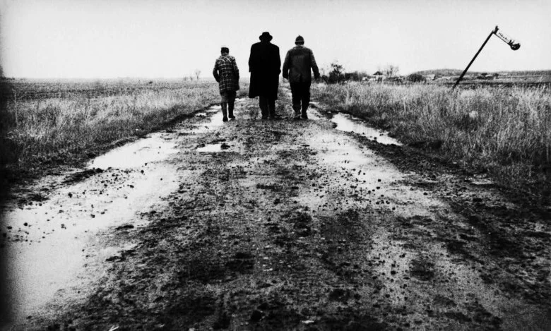 Still from Béla Tarr’s Sátántangó . Image from IndieWire .