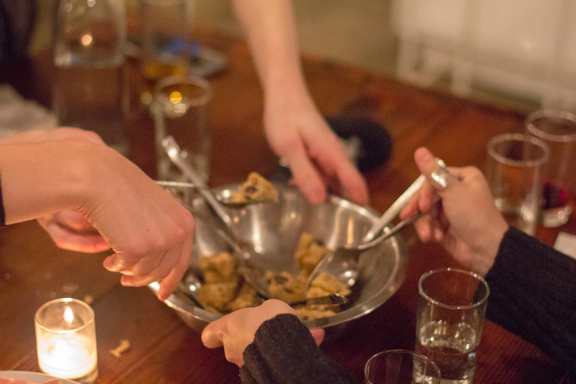 Raw chocolate chip cookie dough served in metal mixing bowls - a scoop of nostalgia with a backsplash of disgust.
