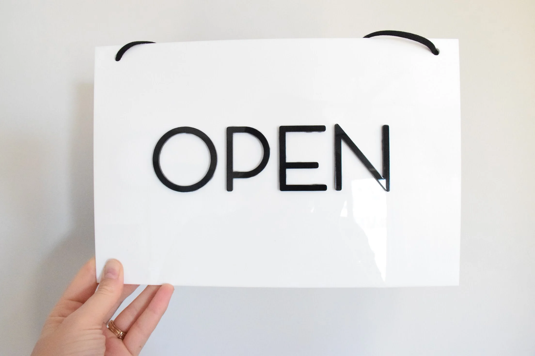open closed sign white acrylic with black acrylic writing