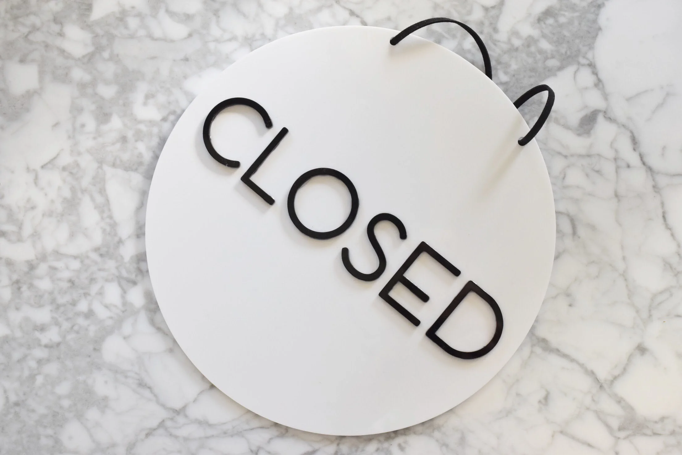 round open closed sign white acrylic with black writing