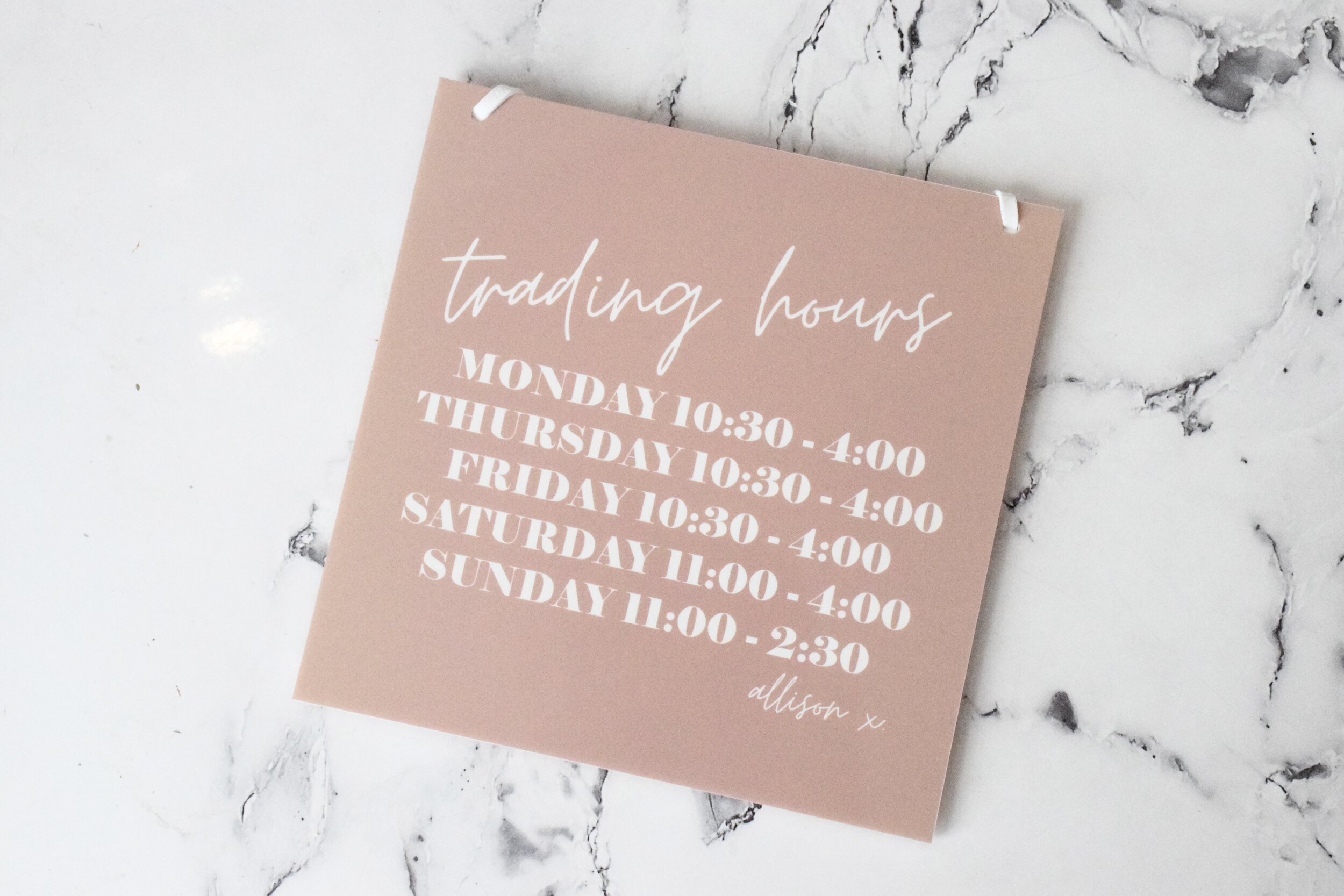 trading hours sign