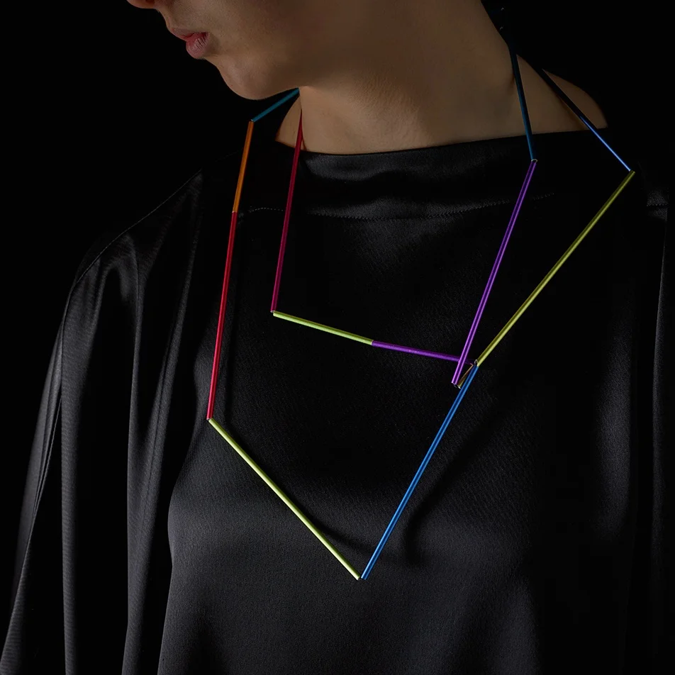Rainbow Lightning neckpiece . Anodised aluminium, sterling silver + silk. SIG