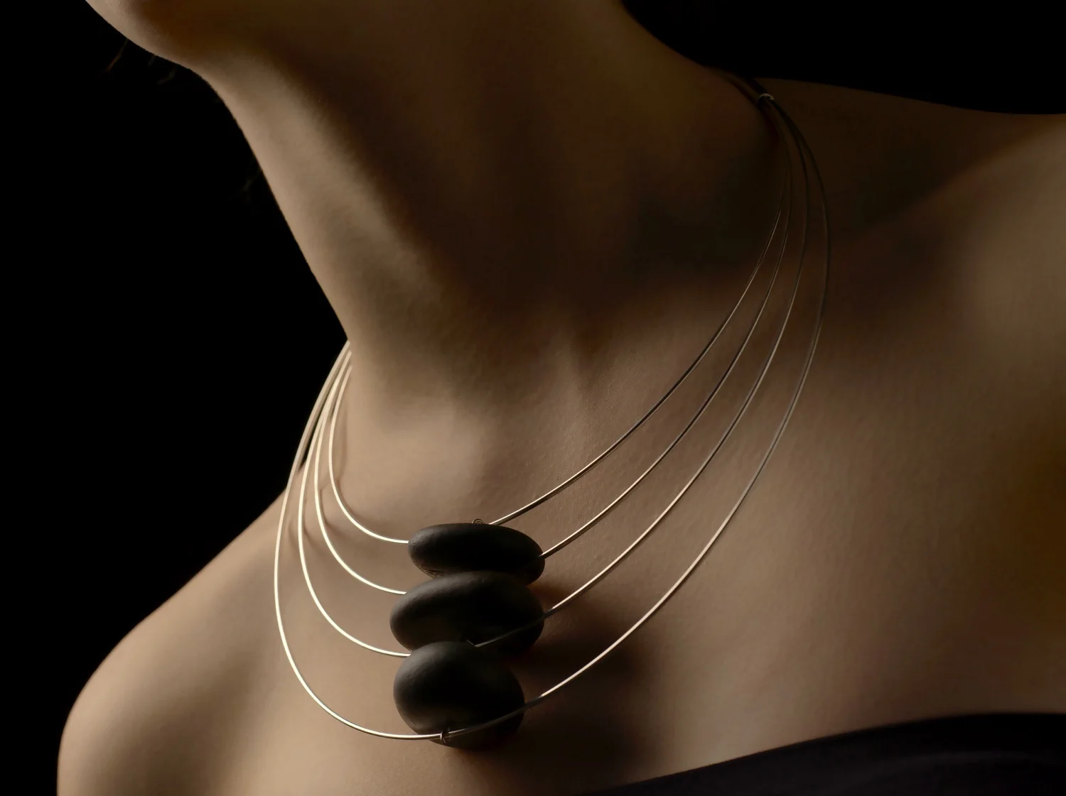 Floating Stones Three with Tasmanian tidal stones + sterling silver. OO/S