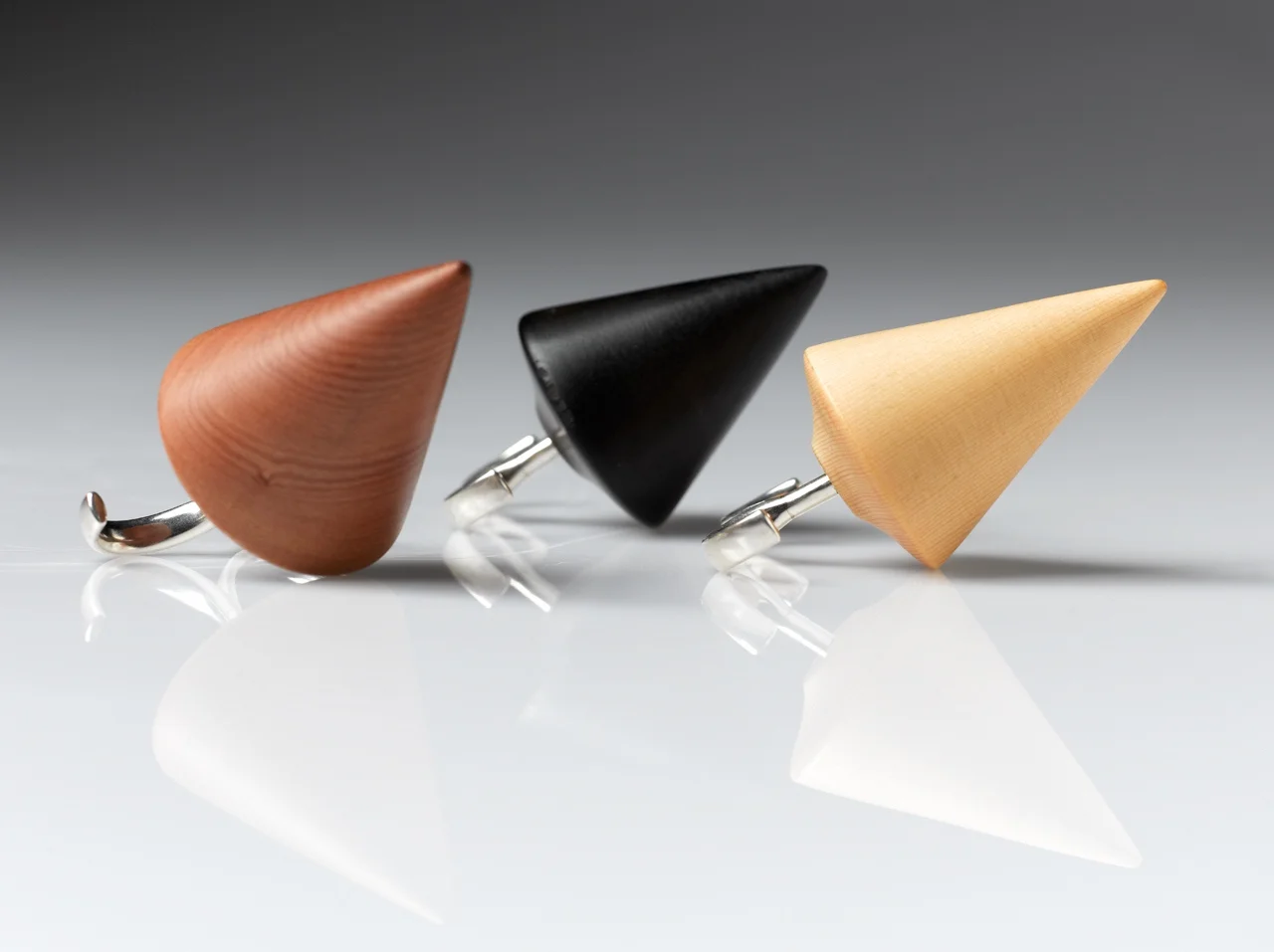 This Way rings in Tasmanian Myrtle, Tasmanian Myrtle with burn finish and Huon Pine + sterling silver. Wood turner, Adrian Oliver Hunt OO/A 