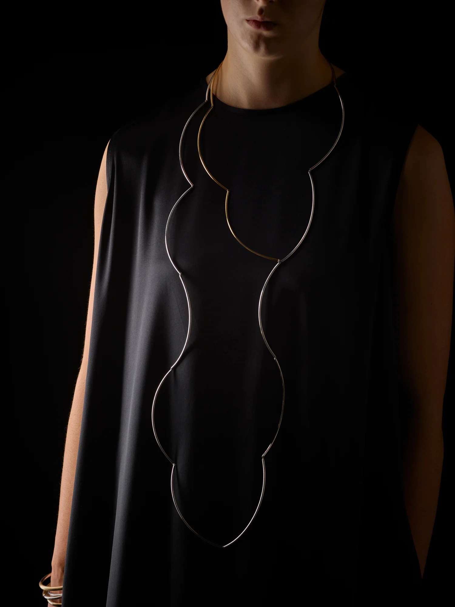 Silver Clouds with Golden Pocket . Sterling silver, 22ct gold-plated over sterling silver + silk. SIG