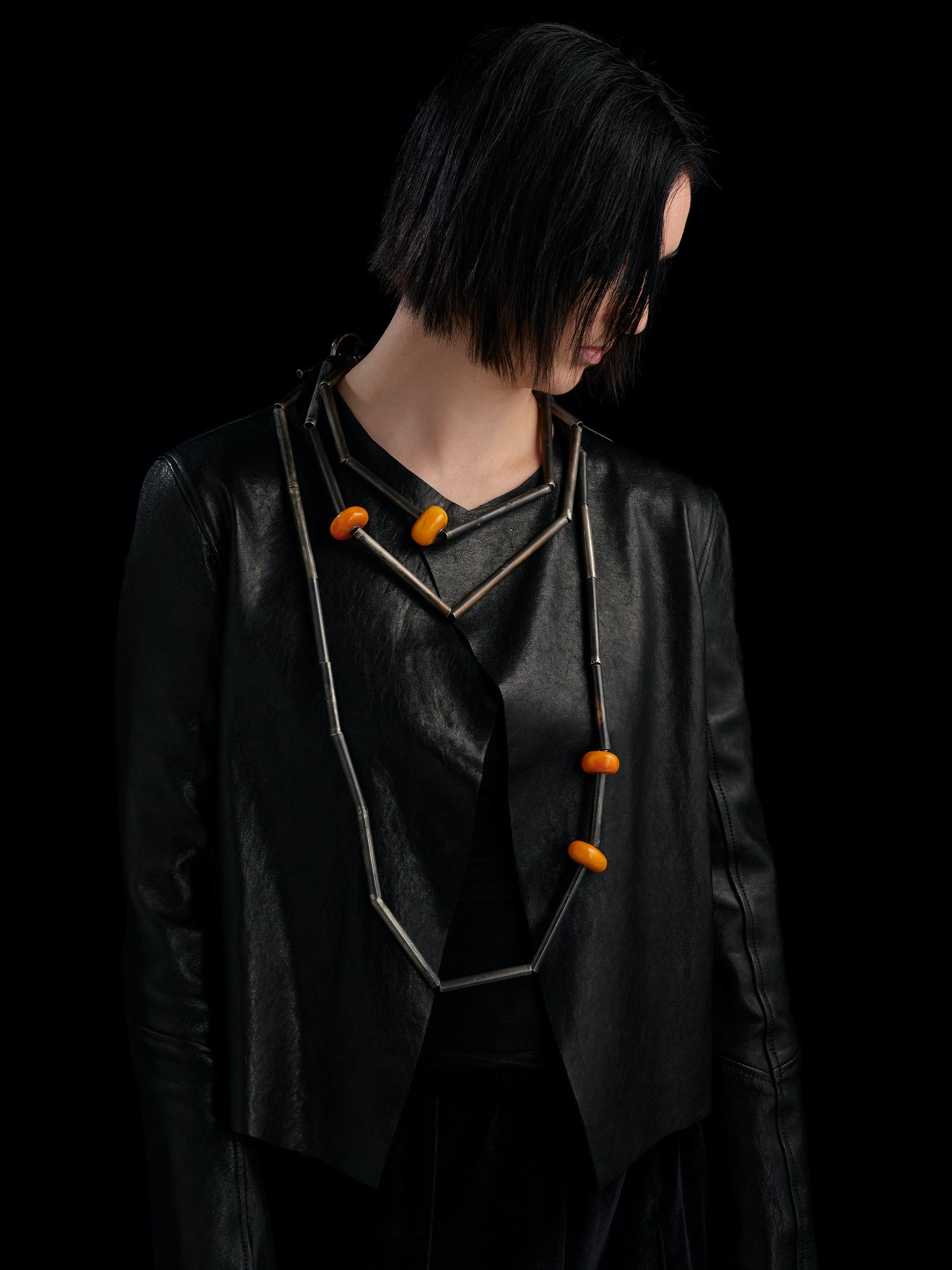   Weathered Berber Torque Branches (long) ‍  ‍ OO/A  worn with  Weathered Berber Torque Branches (medium)   OO/A  and  Weathered Torque Branches (short)   OO/A  all in Oxidised sterling silver, silk + African Amber.   