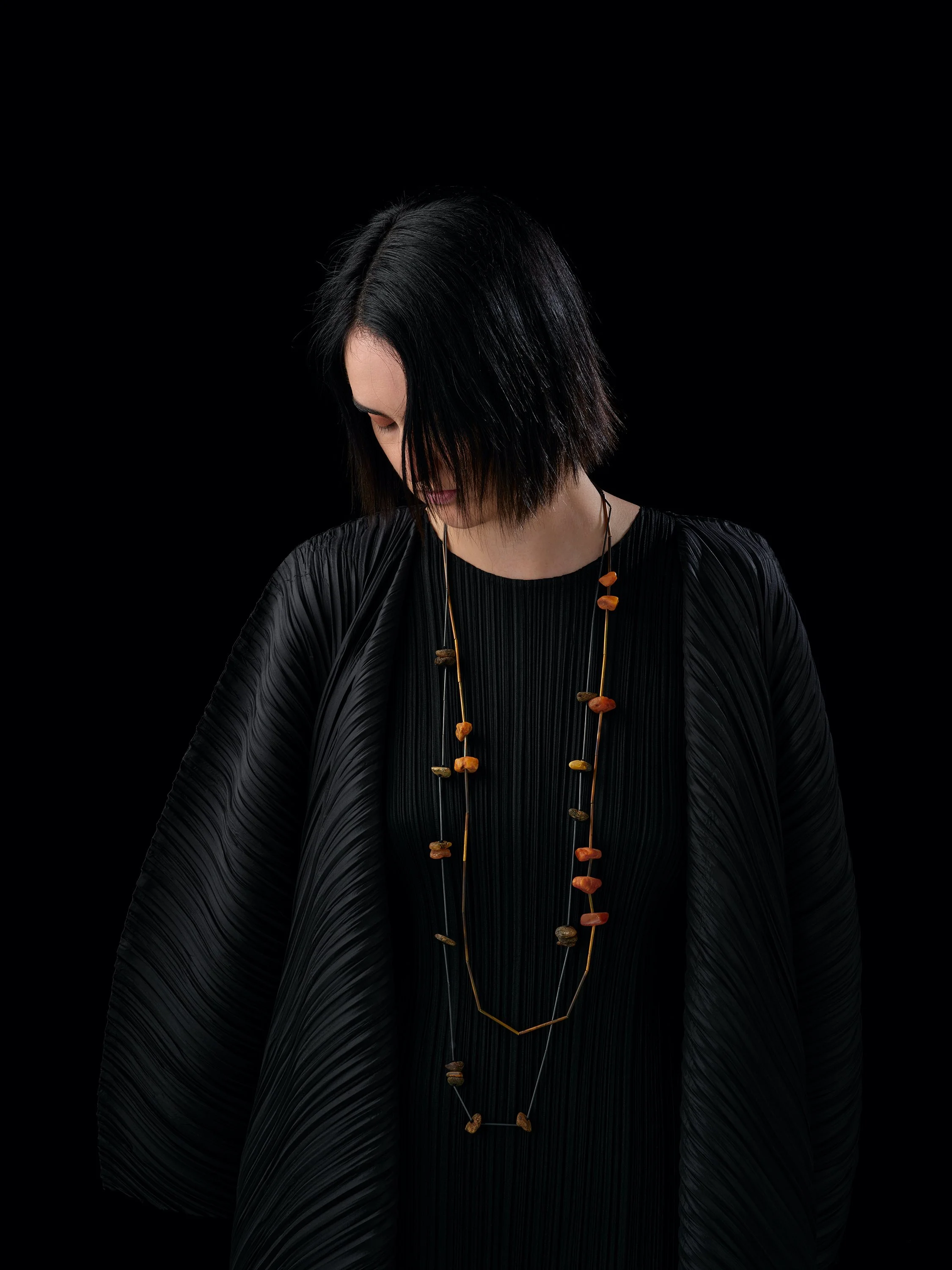   Light Dried Fungi neckpiece  in Raw amber, oxidised sterling silver + silk  OO/S  worn with  Orange Fungi neckpiece  in (orange) raw amber, oxidised sterling silver + silk  OO/S  