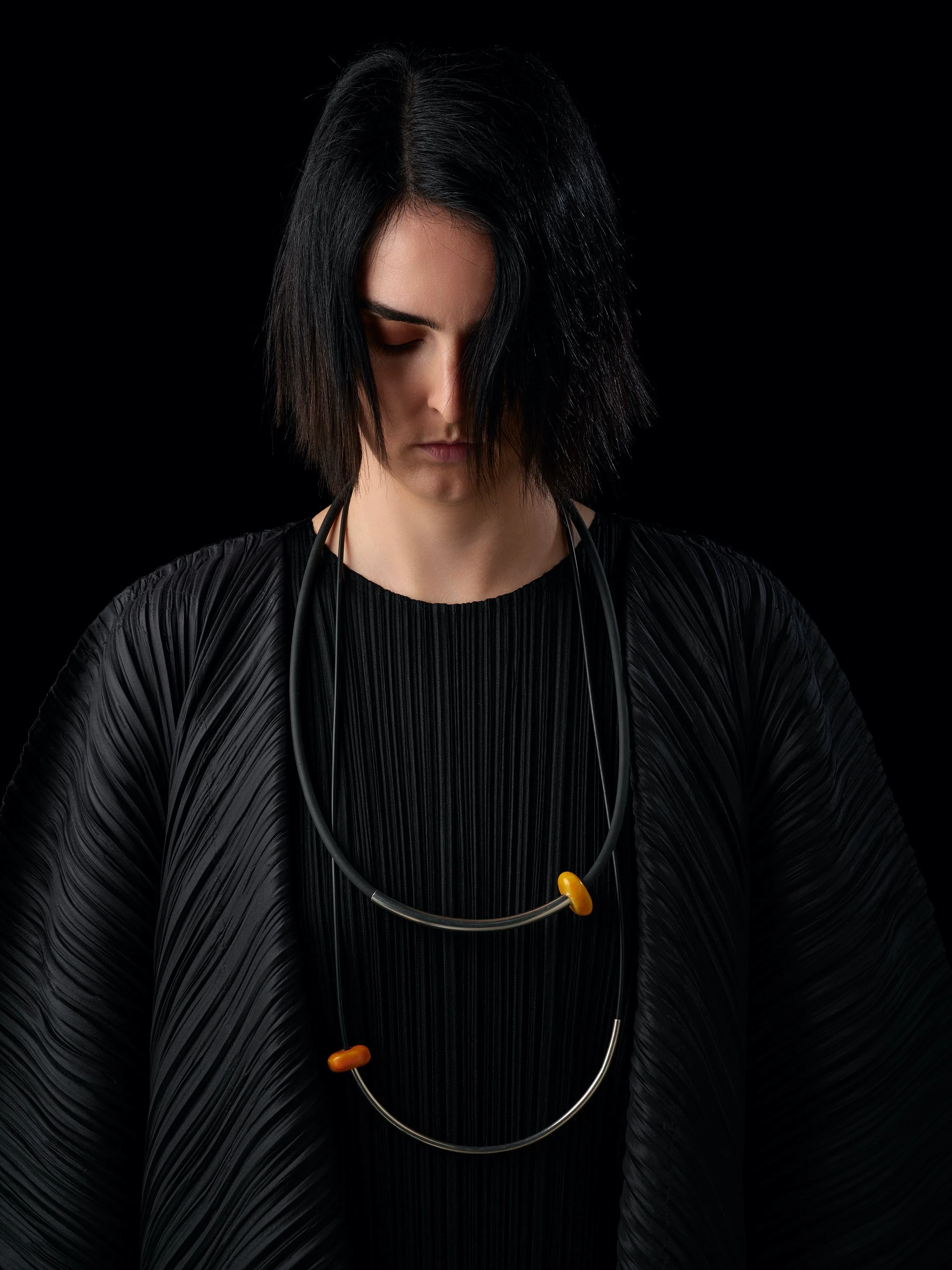   Light Neoprene Berber mid-length neckpiece   OO/A  worn with  Bold Neoprene Berber neckpiece   OO/A  both in African Amber, sterling silver + neoprene.   