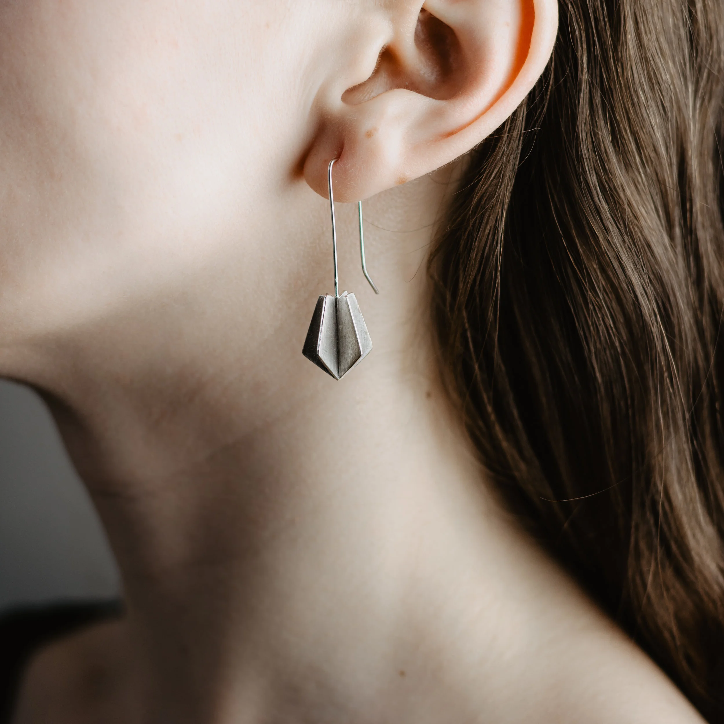 Kate McLaughlin Jewellery 6 edged Tail Fin earrings model shot