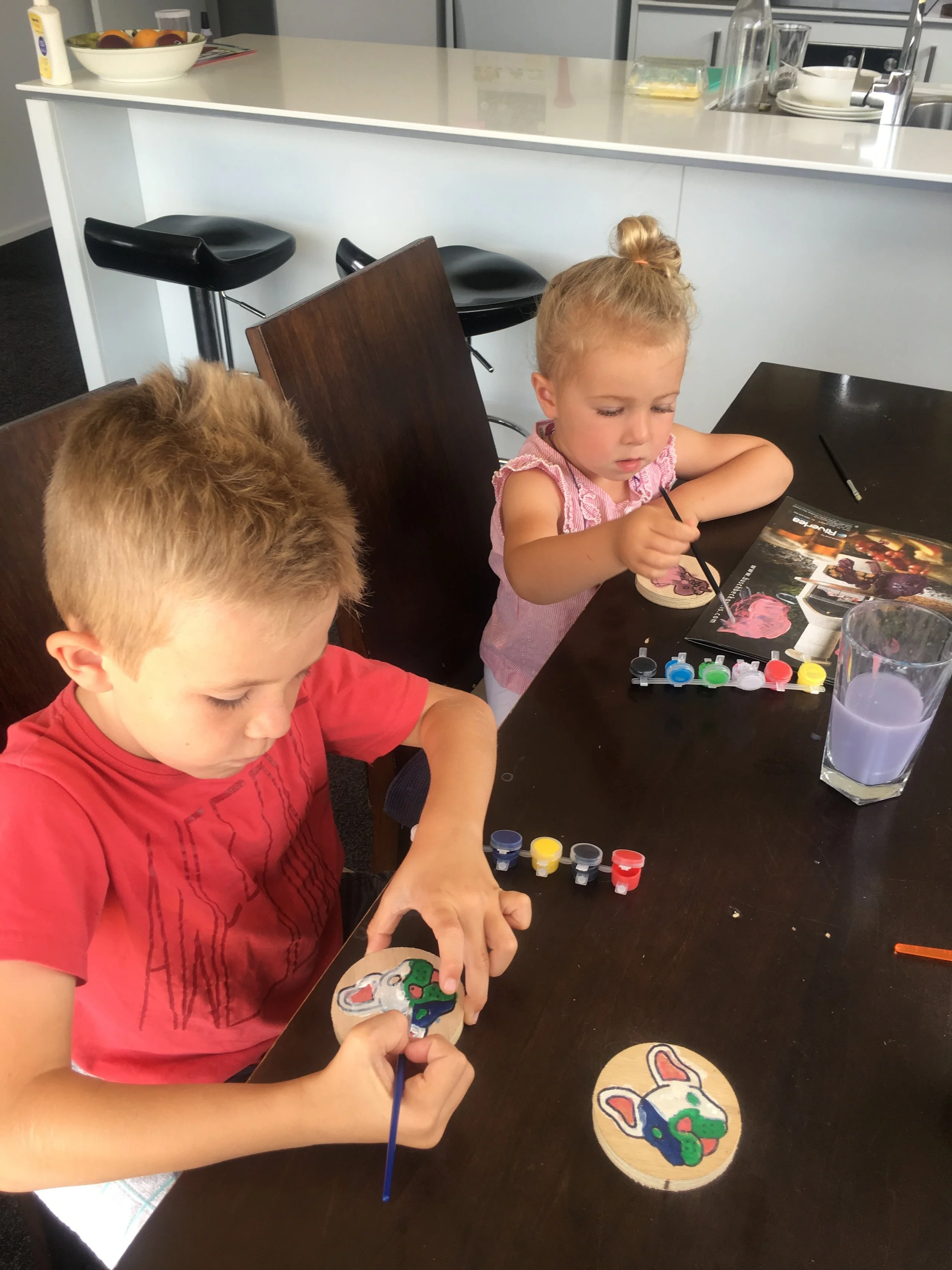 Family fun working together to paint a set.