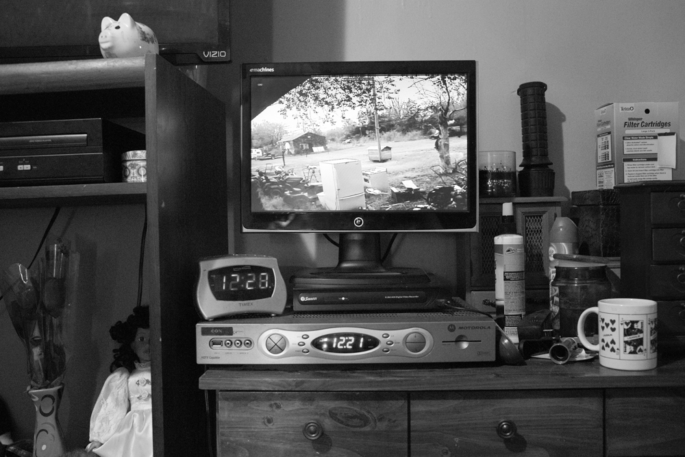 A security camera in the couple's bedroom keeps watch over appliances and lawnmowers in the backyard. SanDral makes money by scrapping, as well as small mechanic jobs.