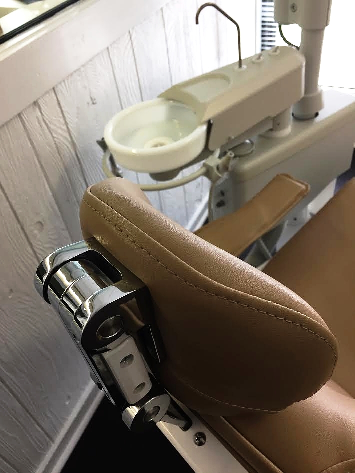 One of Dr. Viera's dental chairs and sink in a third operatory towards the front of the office, just on the other side of the meeting room where Dr. Viera speaks with parents and patients about treatment.