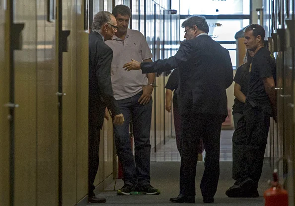 Carlos Nuzman, left, at Brazilian police headquarters on Thursday // Getty Images 