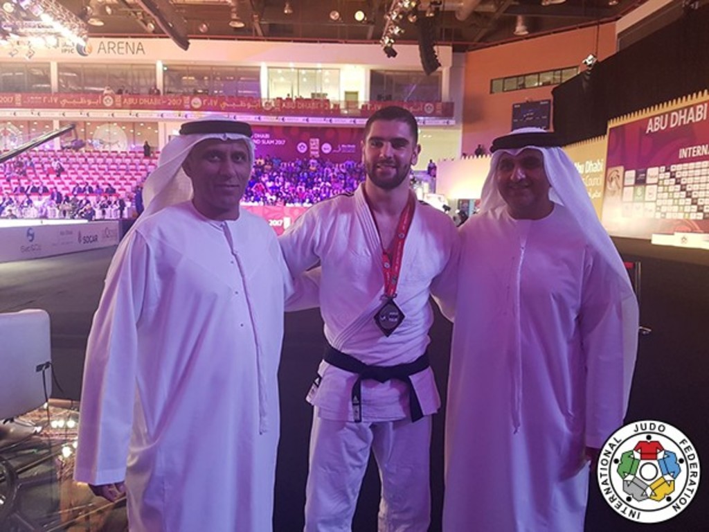 At the IPIC Arena: Israeli judoka Peter Paltchik with UAE judo federation president His Excellency Mohammad Bin Thaloub Al Darei and Aref Al-Awani// IJF