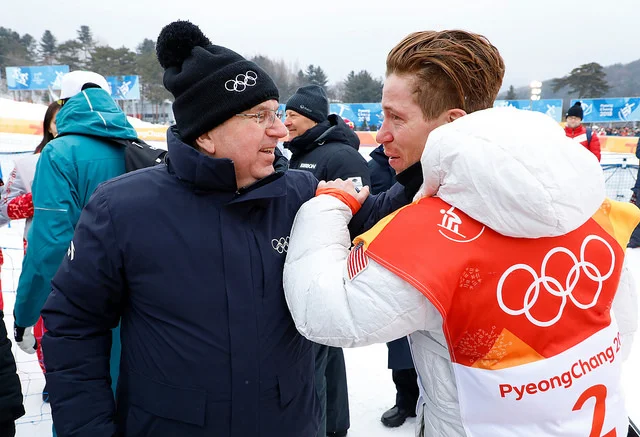 IOC president Thomas Bach with Shaun White's after the snowboarder's 'sick' run to gold // IOC via Flickr