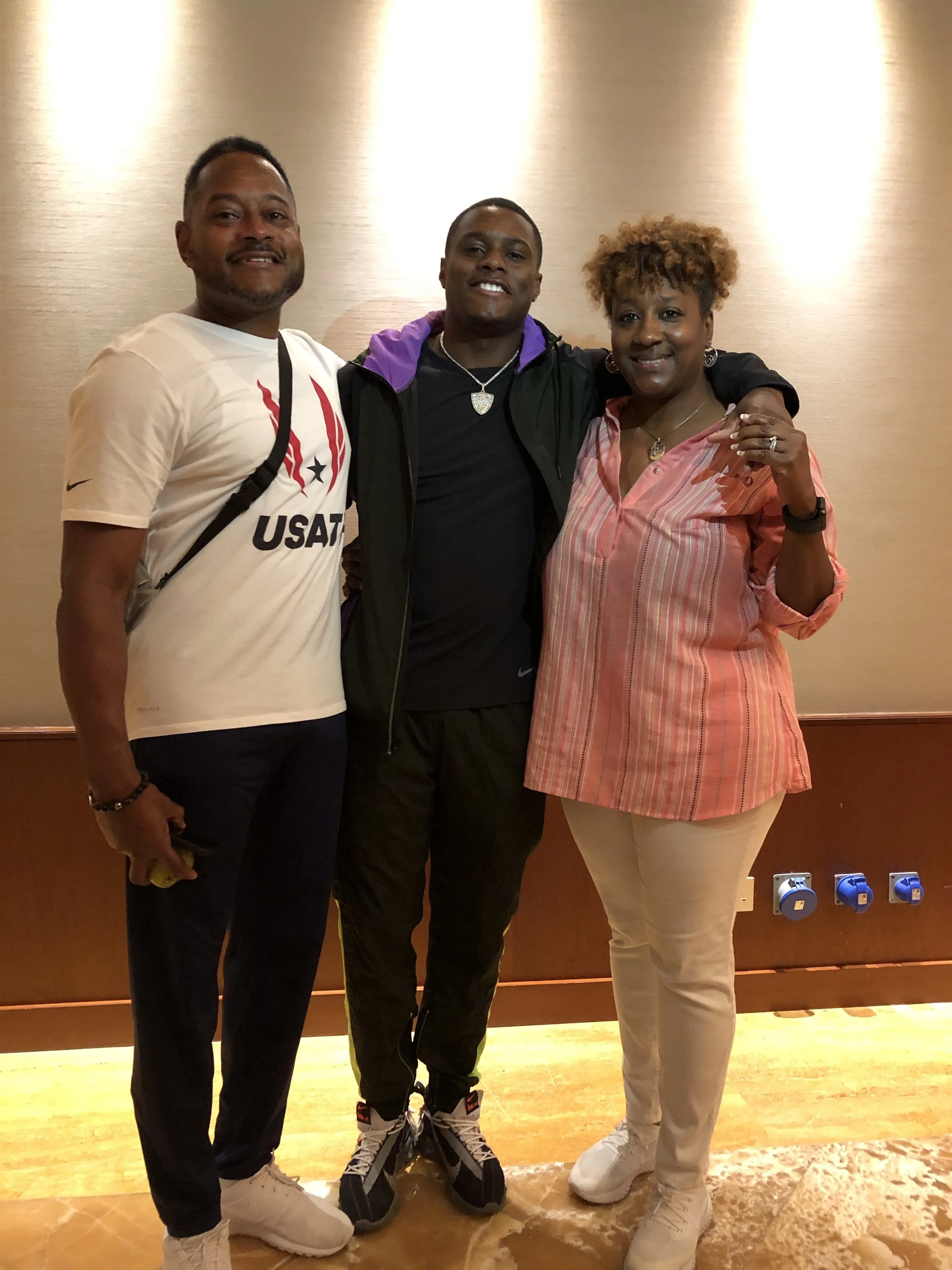 Christian Coleman with his father, Seth, and mother, Daphne
