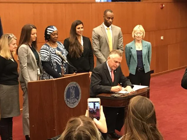 Virginia Governor Terry McAuliffe signs Executive Order 73 creating the Environmental Justice Advisory Council (photo: NRDC)