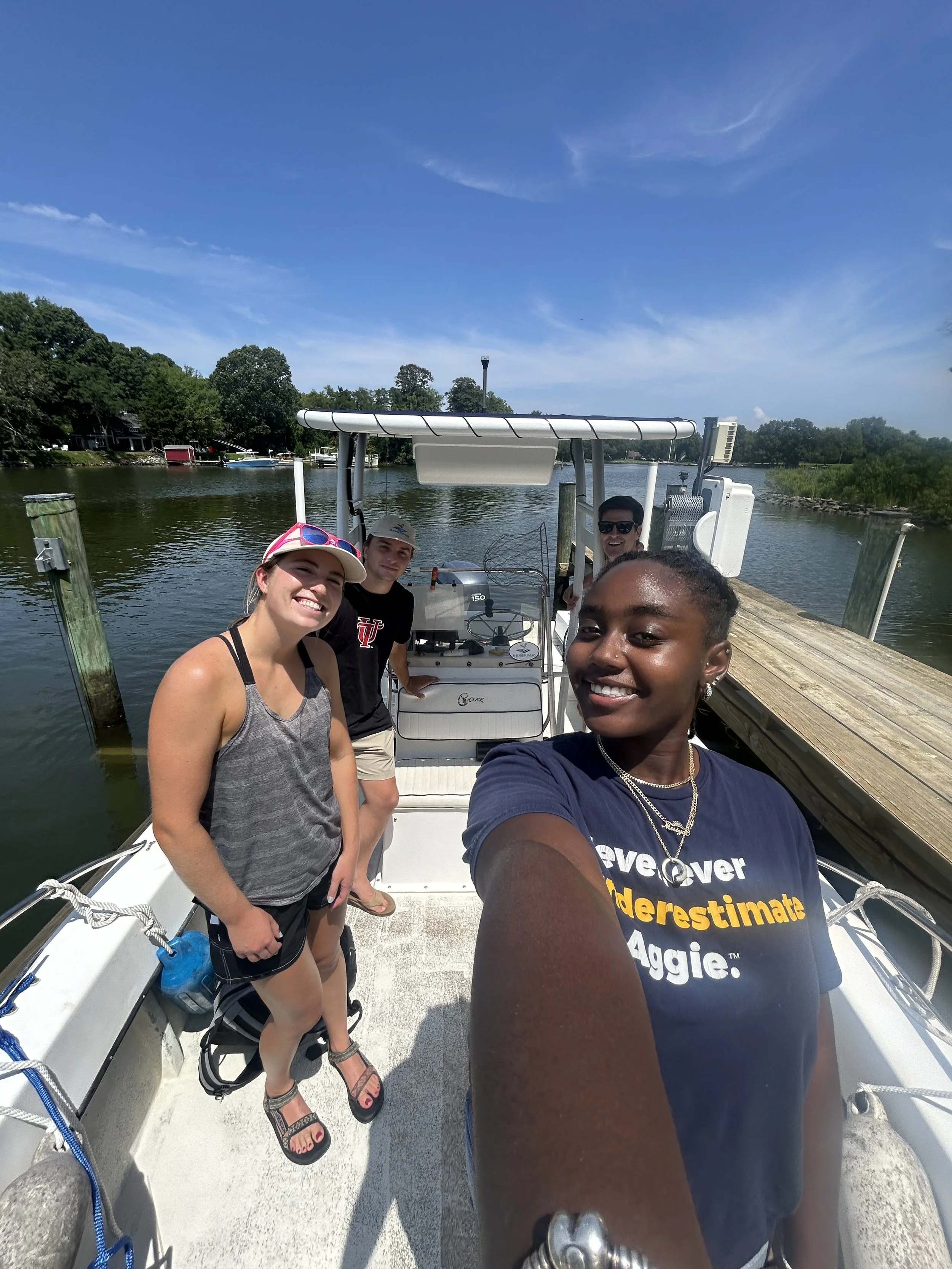 Genesis on a boat ride with ShoreRivers to test the water in the Eastern Bay