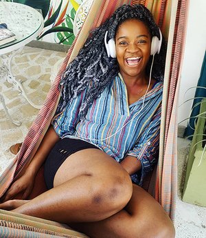 I (Adaeze Nwoko), am lounging in a hammock listening to music, while soaking in the seasalt air in Cartagena Colombia.