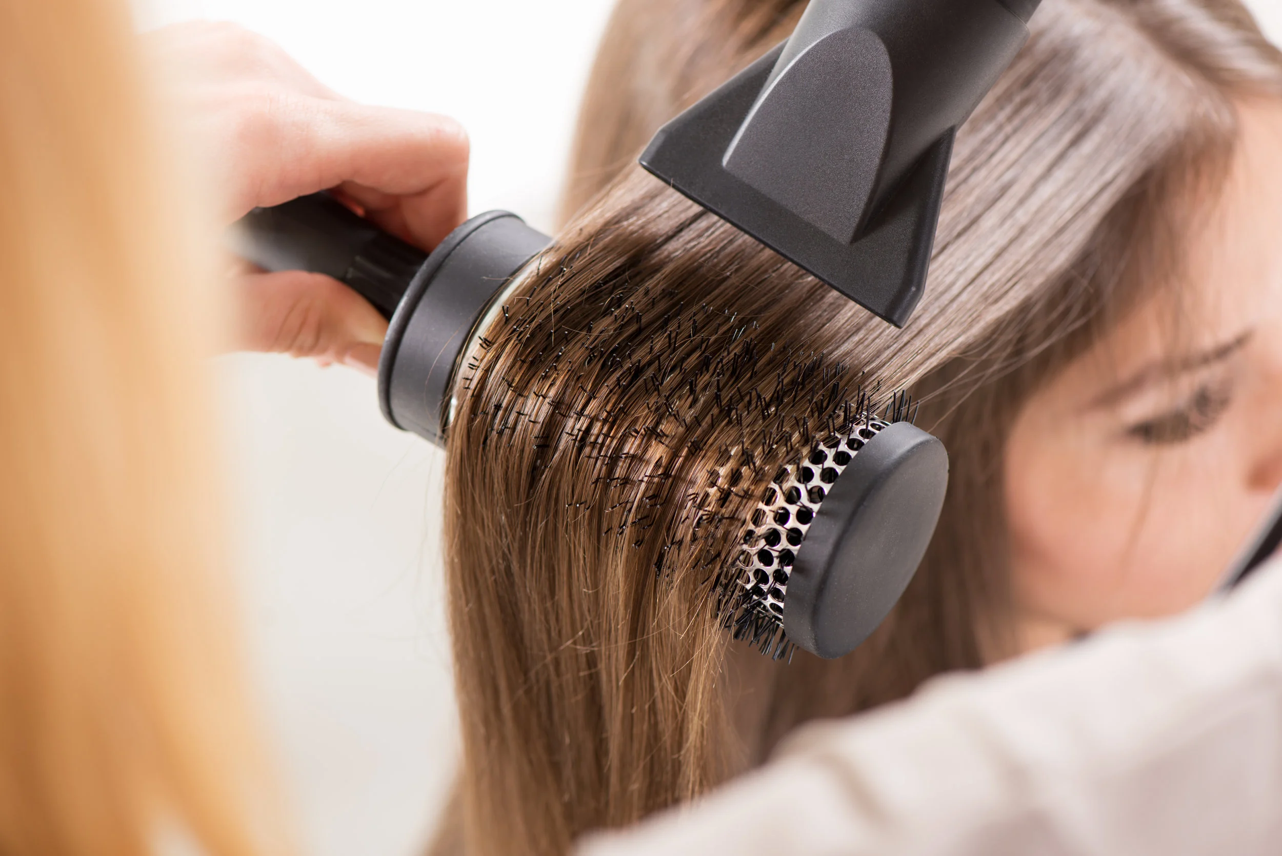 stock-photo-drying-long-brown-hair-with-hair-dryer-and-round-brush-close-up-197226602.jpg