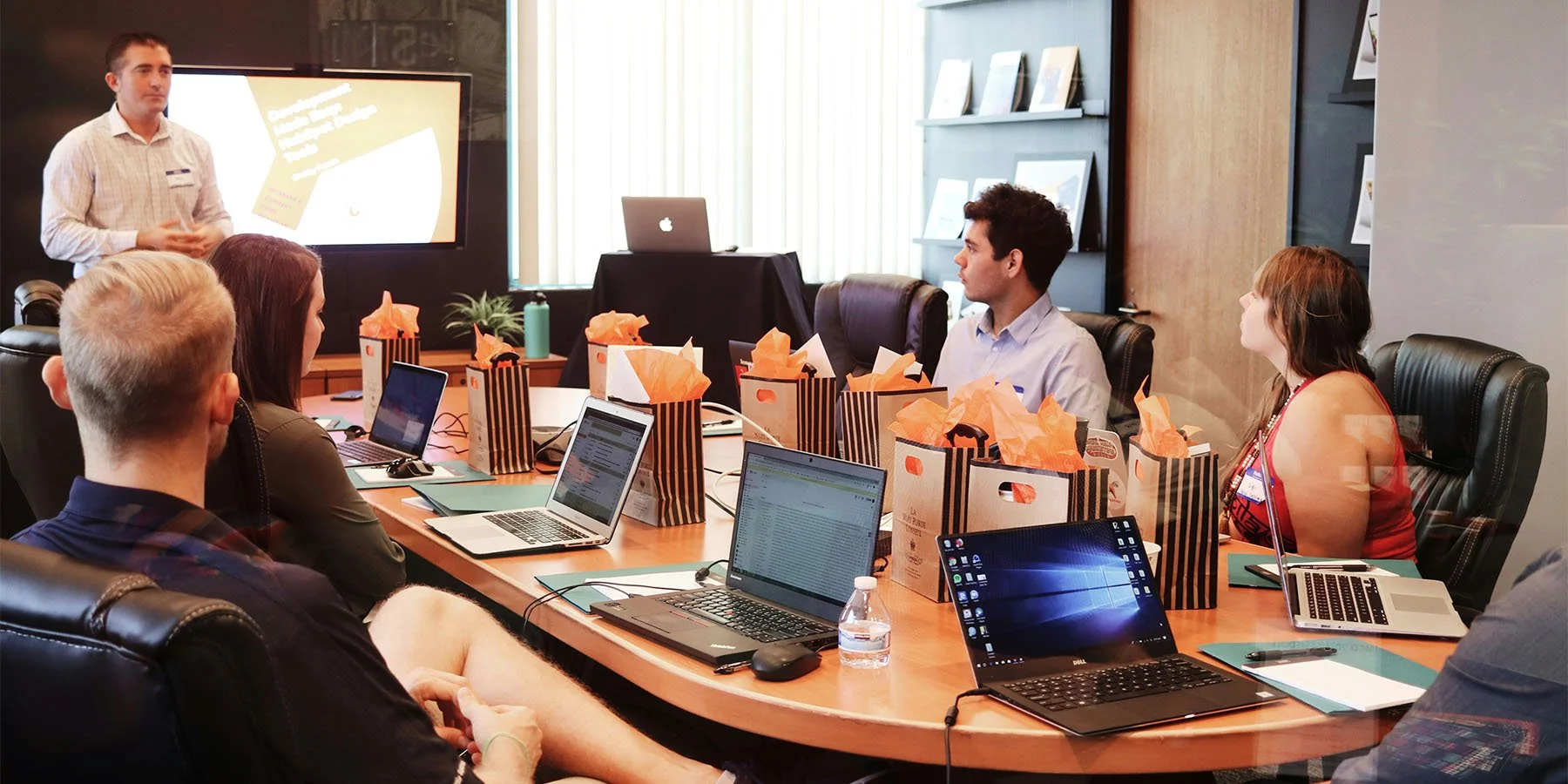 Meeting around a conference room table.