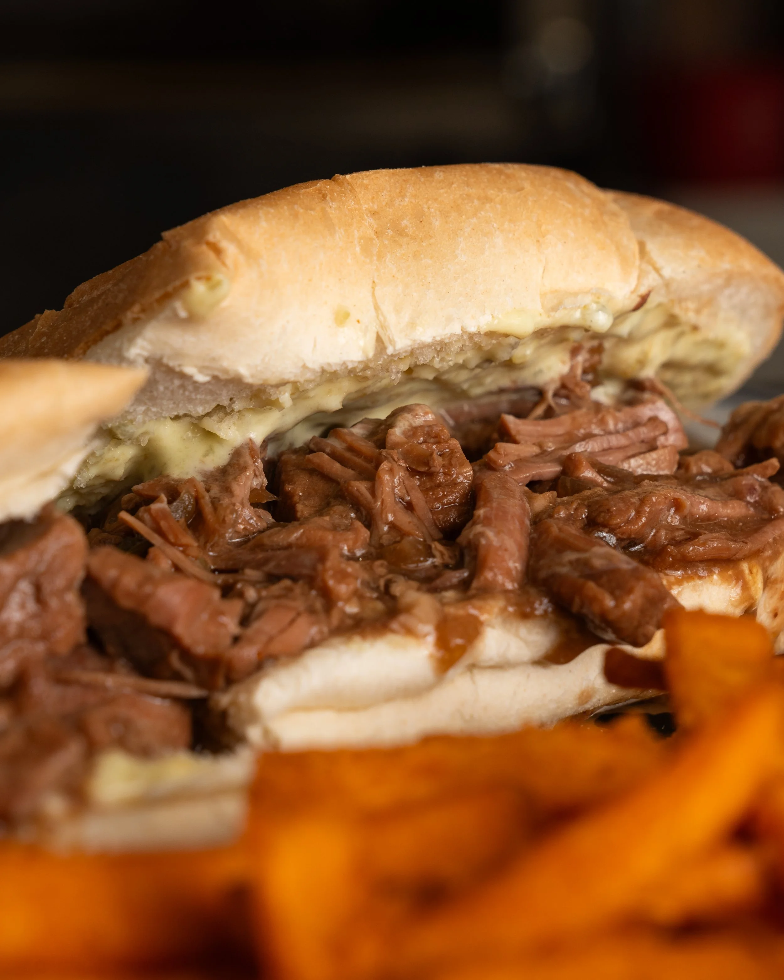 Our Mom’s Rockin’ Roast Beef Po’boy with shredded roast beef and jalapeño cream cheese spread.