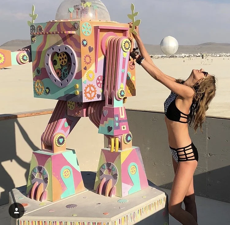 SPOTTER: Natalia Kisielewska WHERE: Black Rock City, Nevada This year’s Burning Man theme was “I ROBOT”. Although maybe this interpretation was not the biggest, it was definitely the cutest and sweetest little robot we have seen. Located in the temple and made of wood, it was smiling and welcoming everyone.