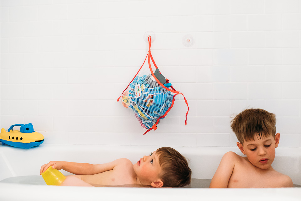 Brothers taking a bath together.