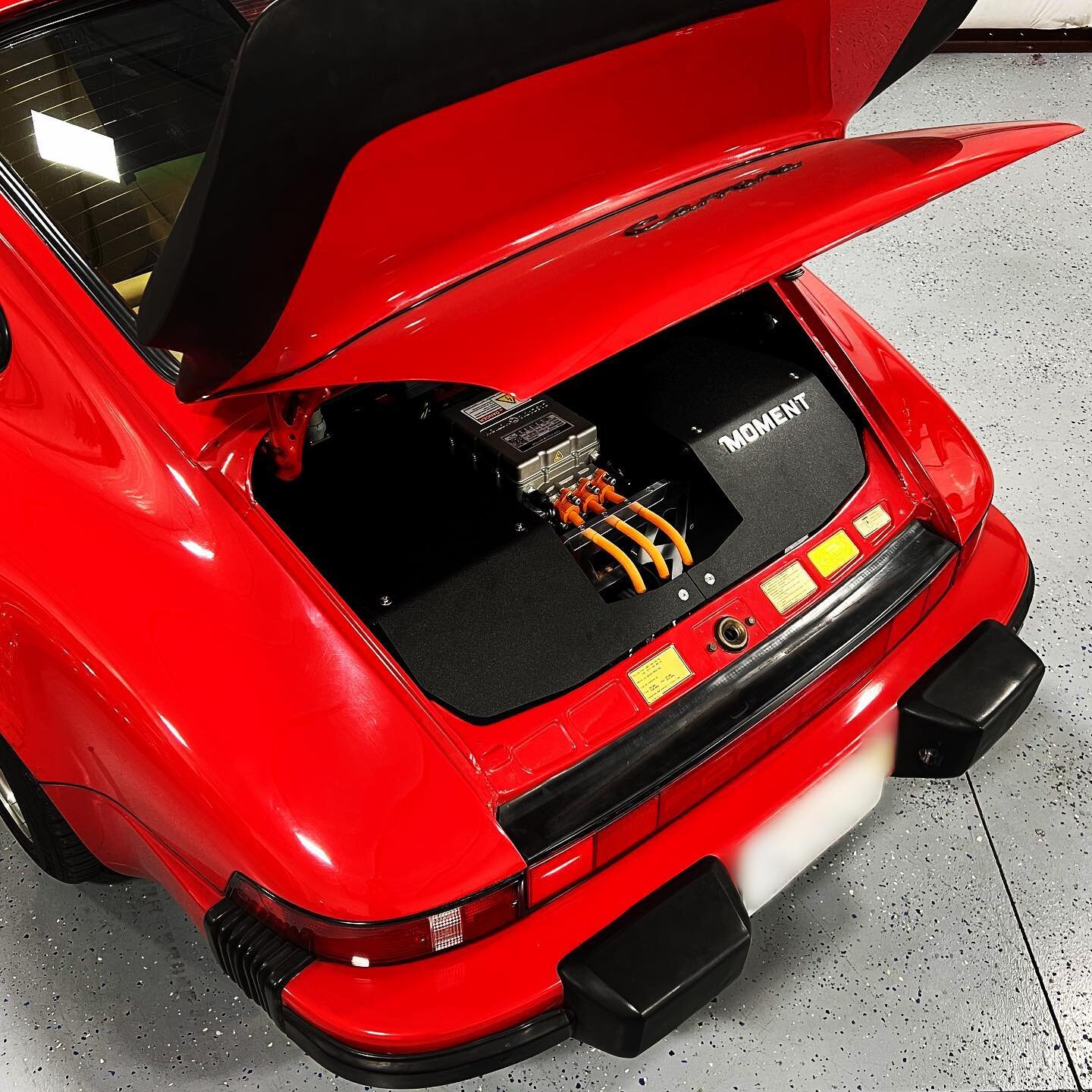 A peek inside our little red rocket&hellip; it can&rsquo;t just blow them away on the street, it has to when you pop the hood too #porsche #porsche911 #classicporsche #classic911 #Moment911 #classicev #electriccar