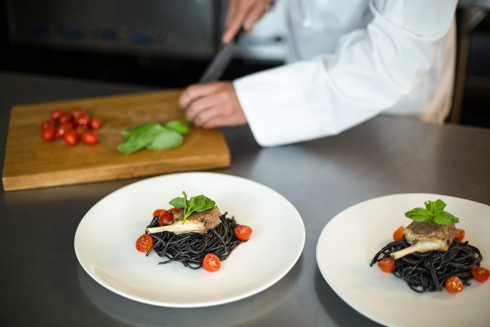 bigstock-Handsome-chef-slicing-garnish--178435348.jpg