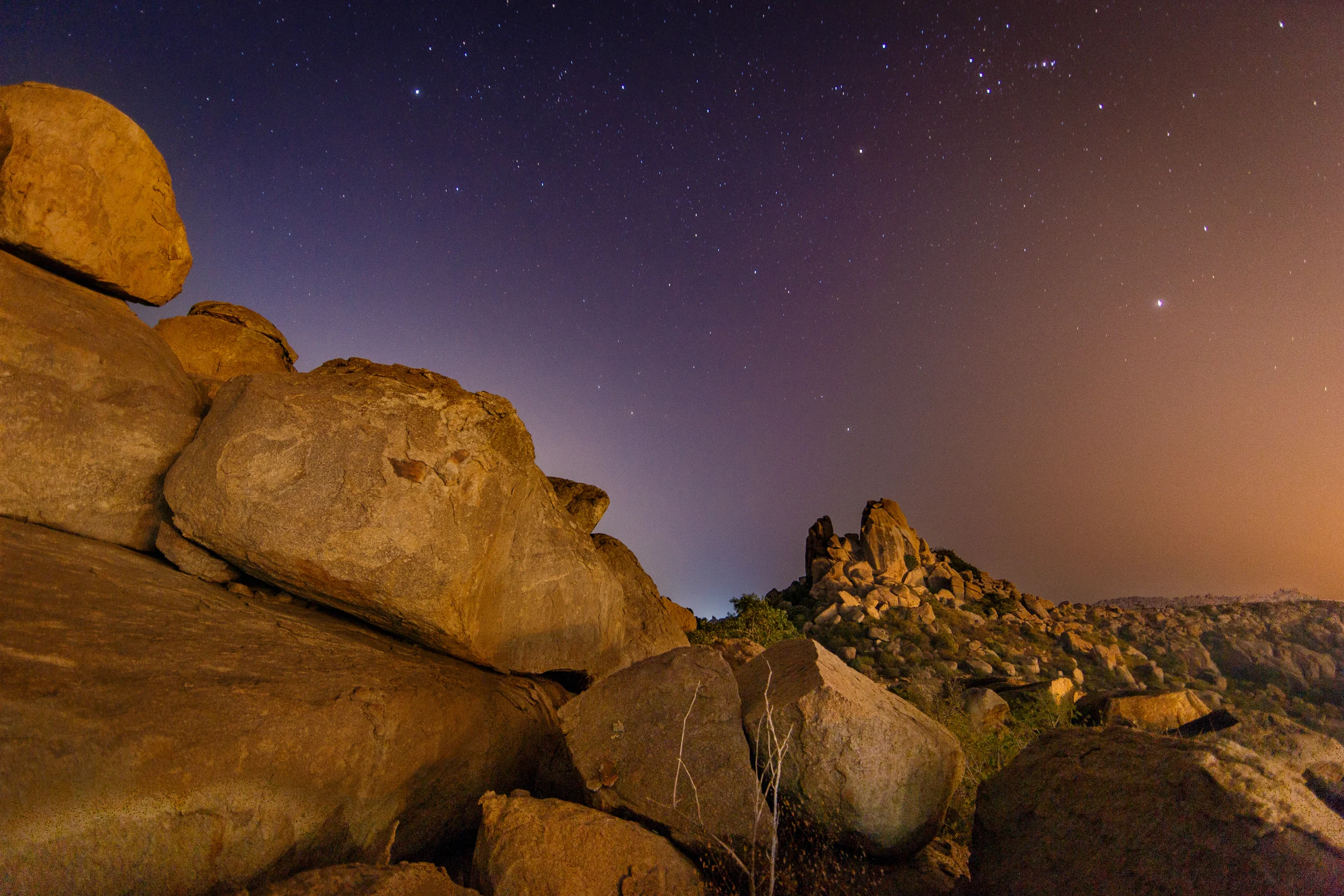 Locals and tourists alike pile up onto these rocks on Hampi island to watch the sun set each night over the immense boulders and temples scattered across the land.