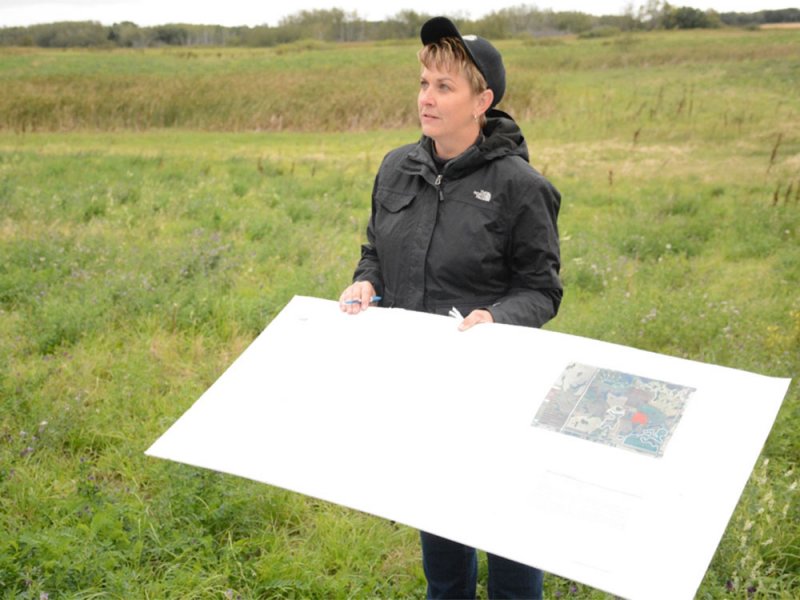  Pam Iwanchysko describing her grazing plan while standing in one of the planned grazing pastures during a tour on September 10, 2015  