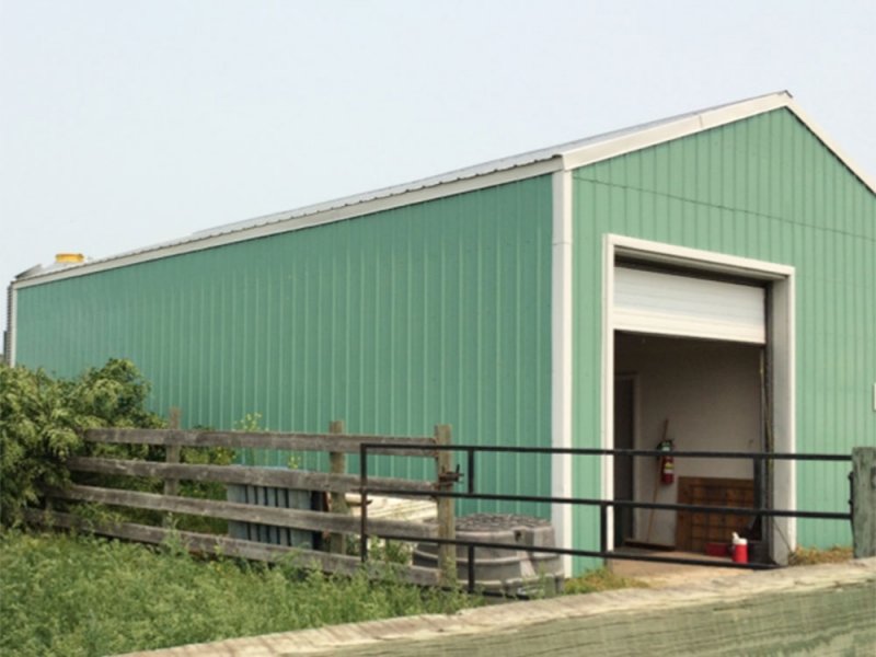 The insulated shop at the Johnson site with overhead door, office and washroom