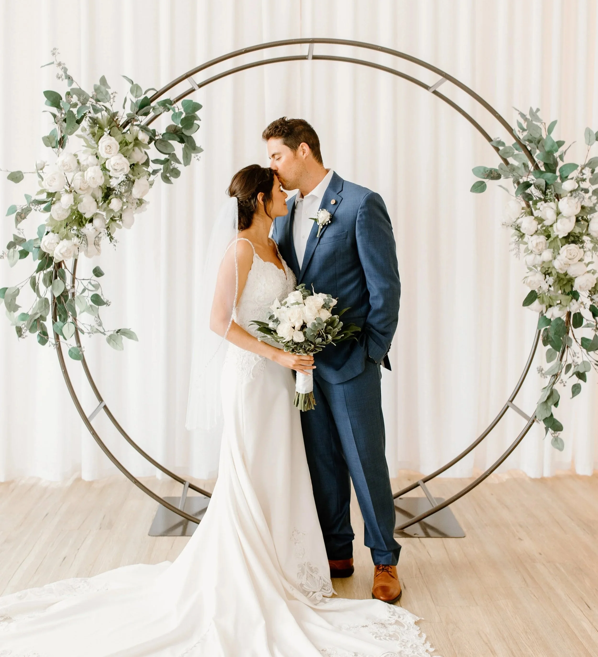 Circle wedding arbor with faux floral arrangements