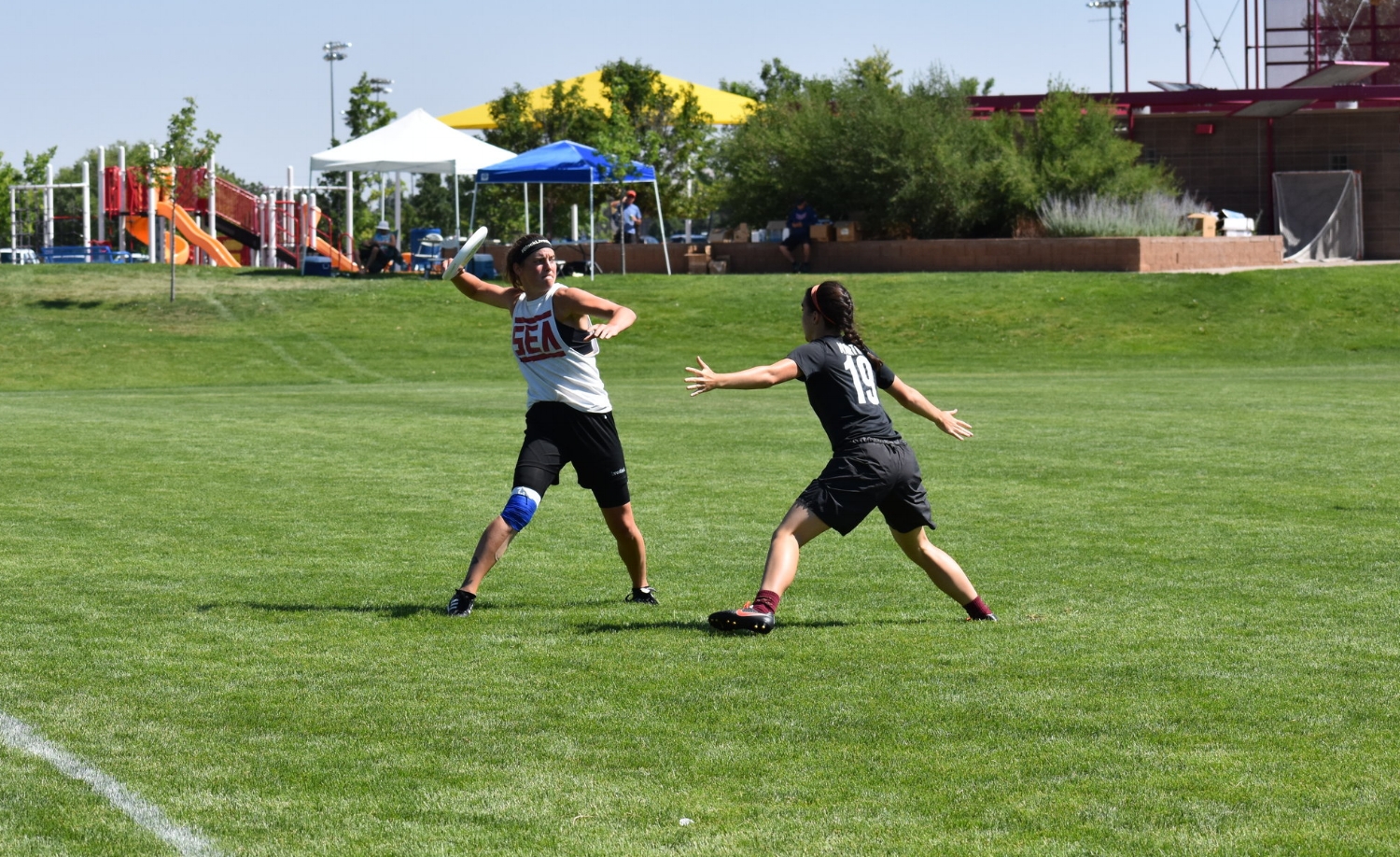 Drew Johnson of Seattle Mixtape winds up for a flick against Boston Slow White's Olivia Hampton. 