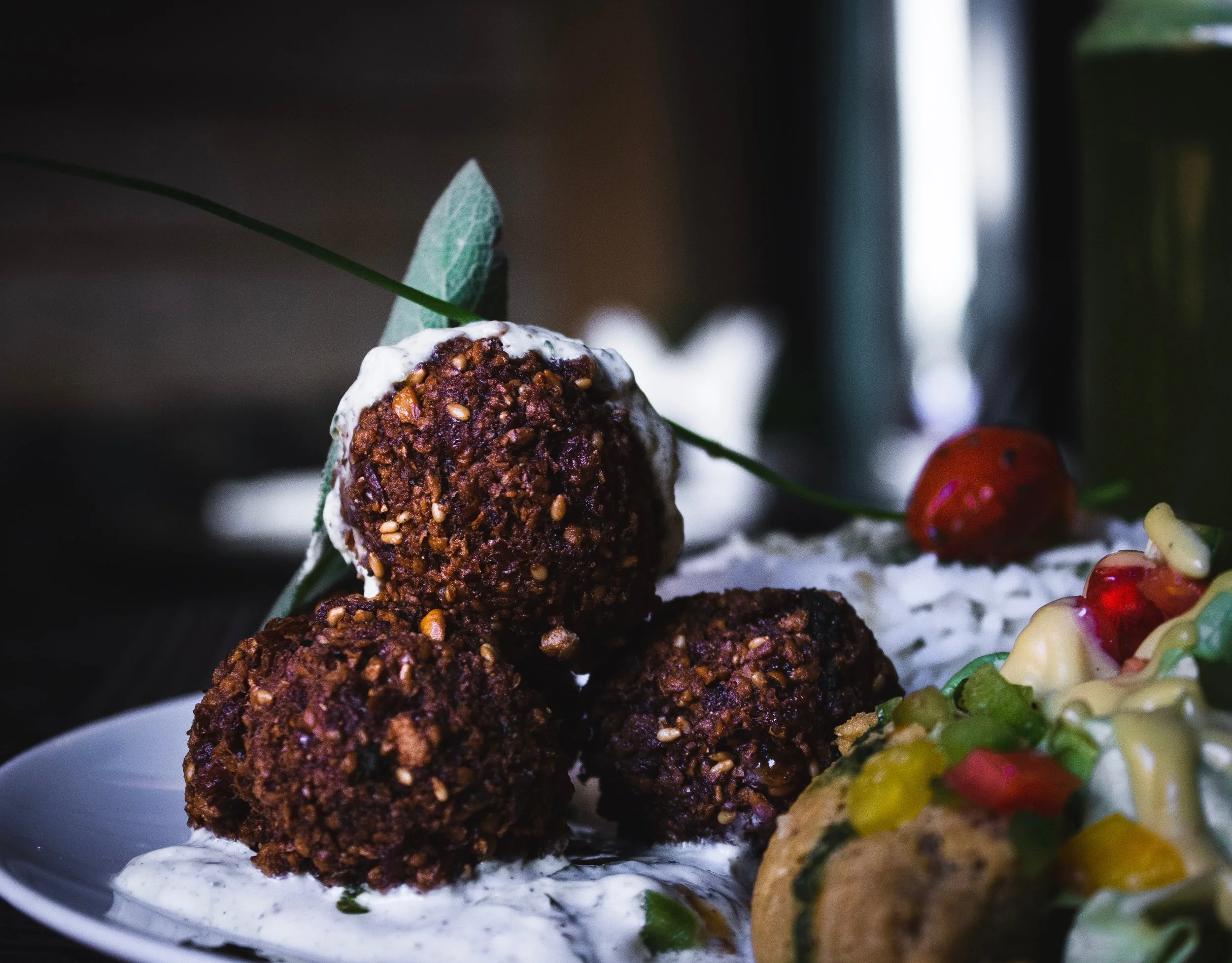 falafels in tel aviv israel covered in cream.jpg